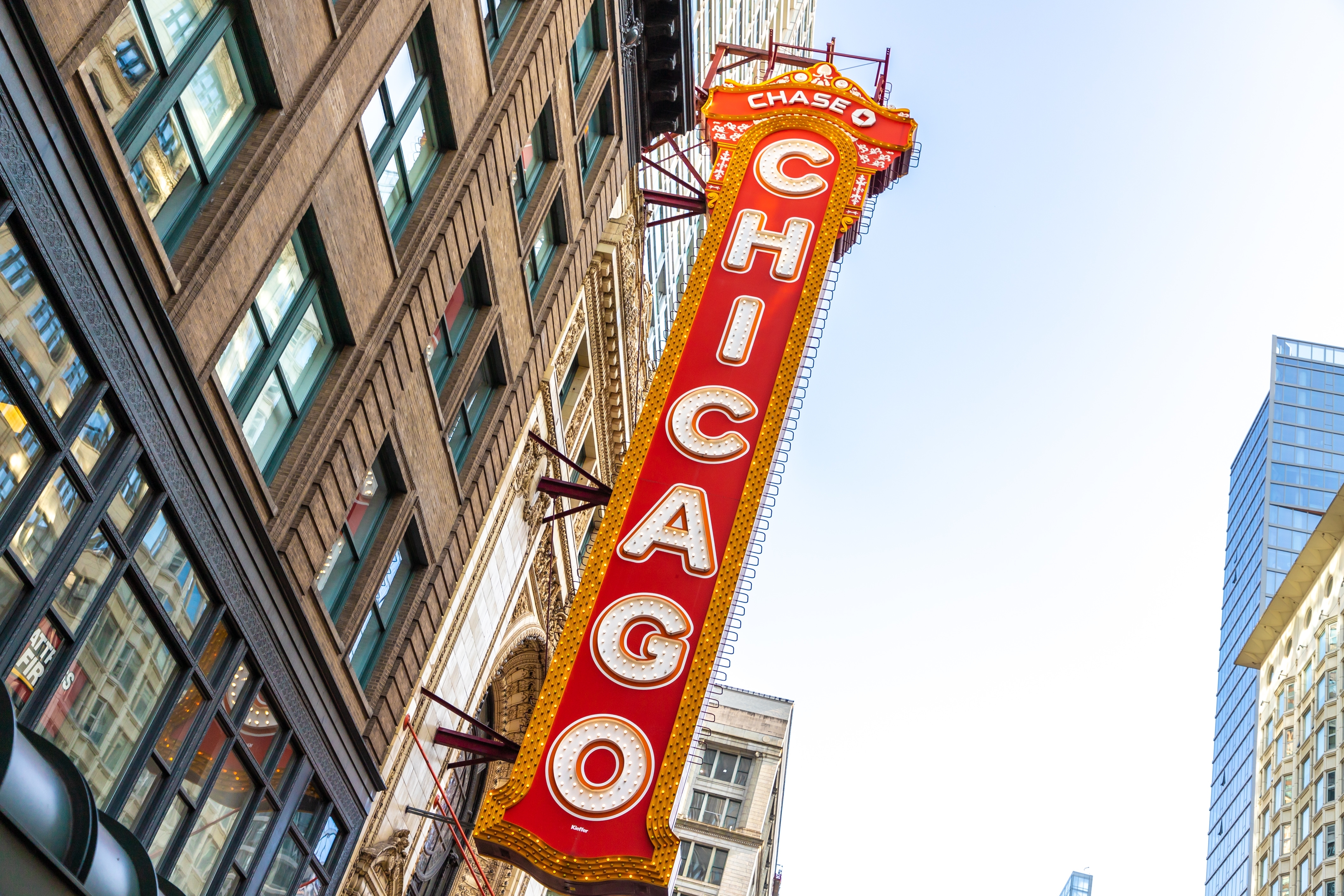 The vertical yellow and gold Chicago Theater sign.