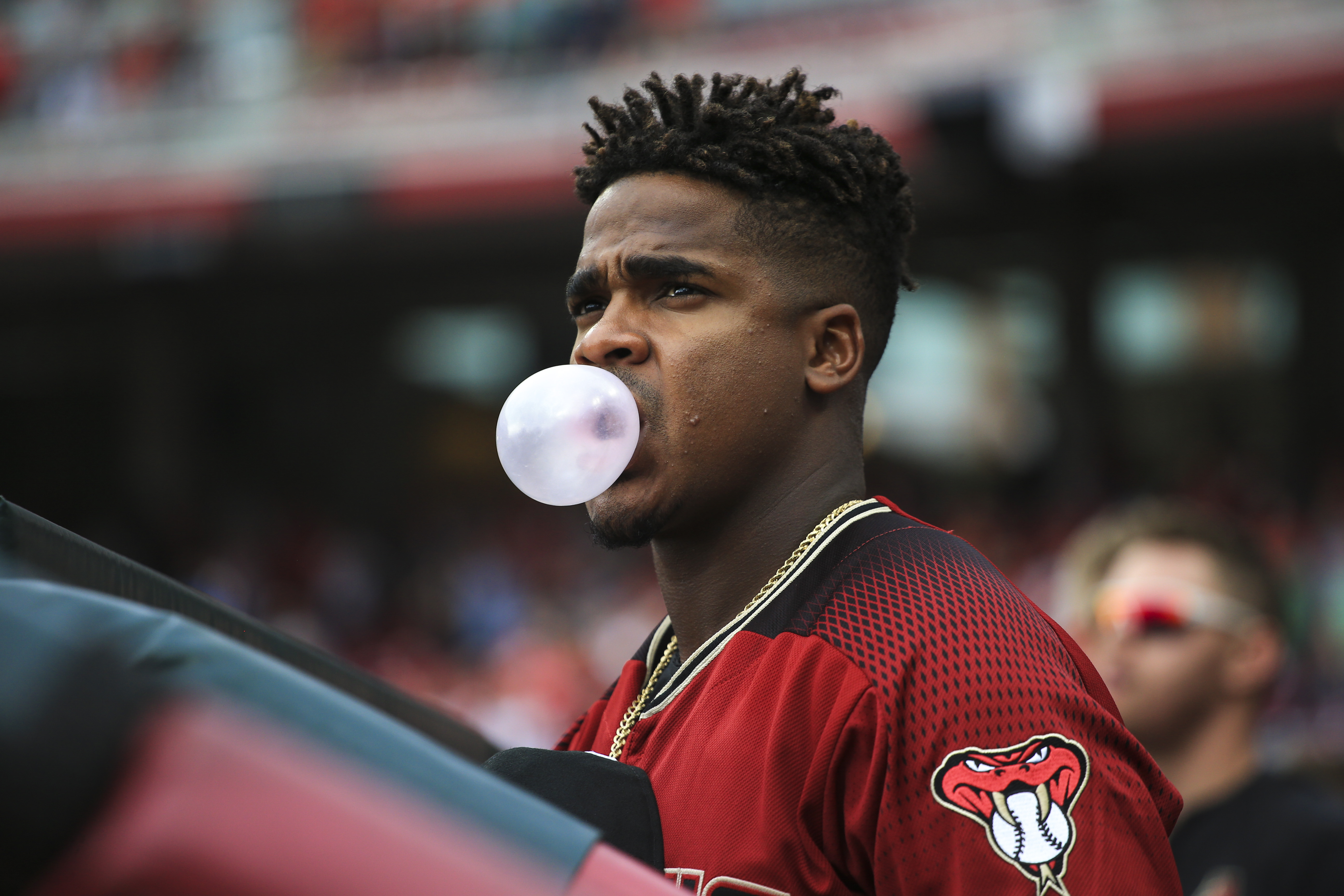 Domingo Leyba blows a bubble at Great American Ball Park.