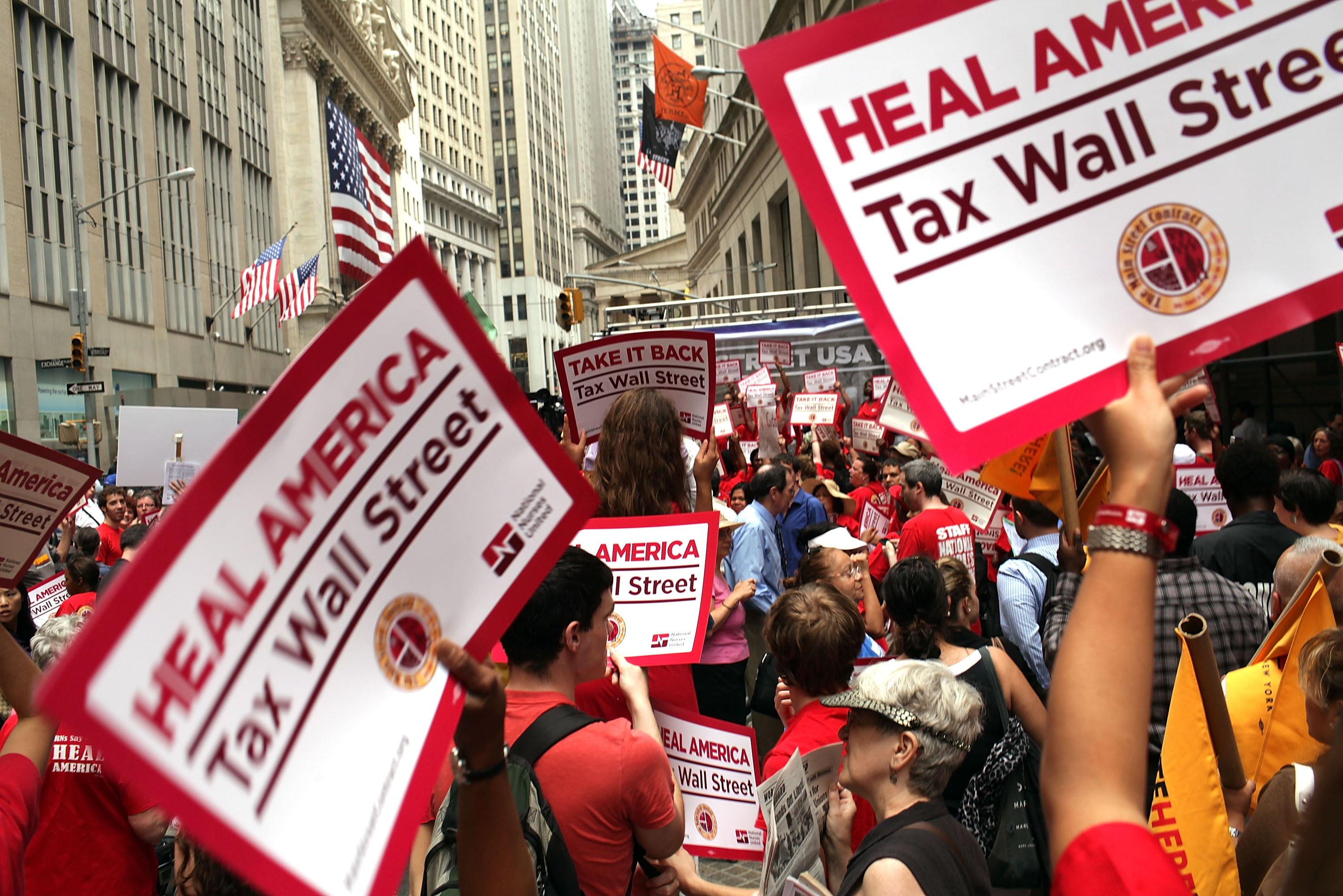 Members of the nurses union, National Nurses United, and other workers converge on Wall Street to protest against financial intuitions and inequality on June 22, 2011 in New York City.