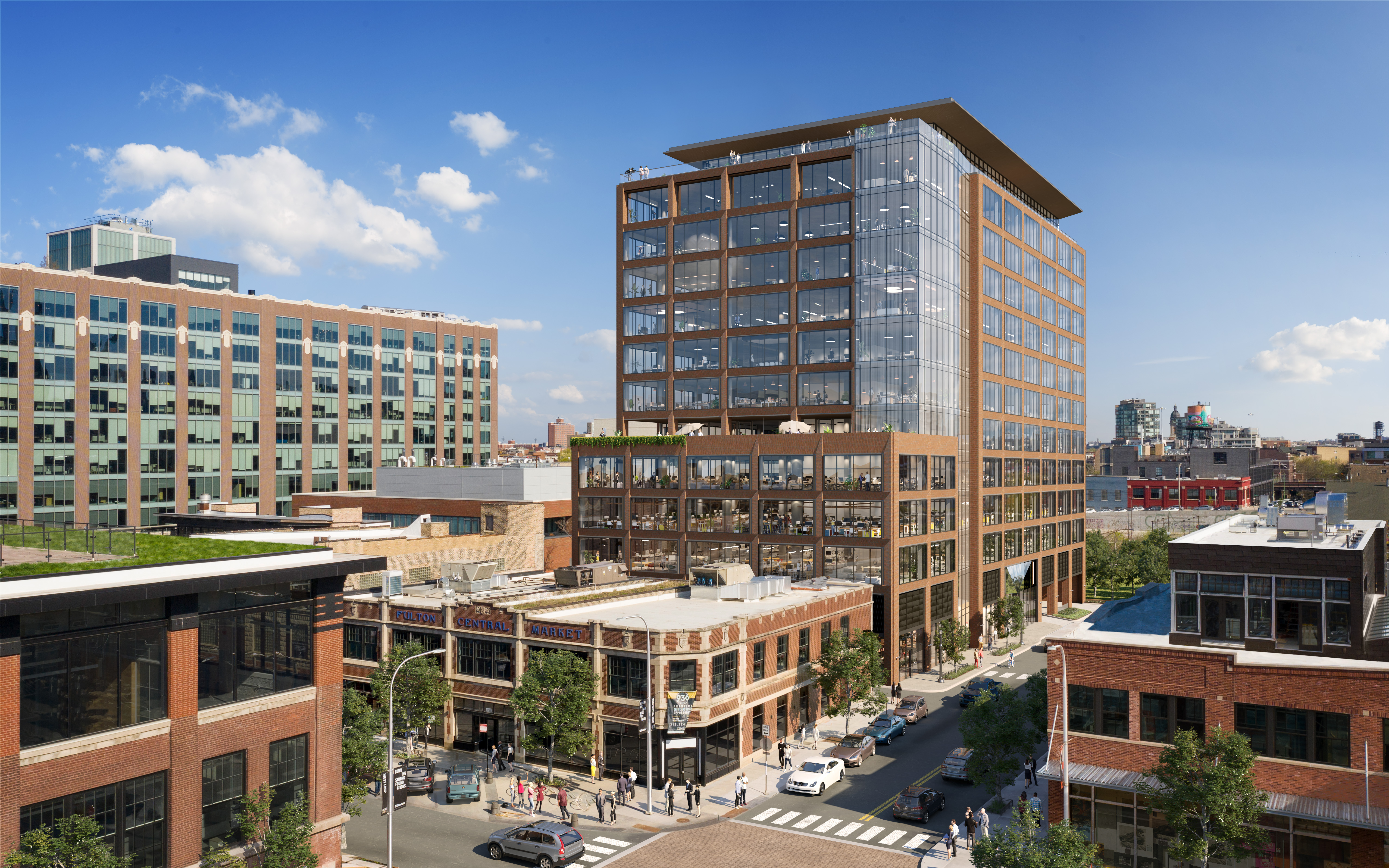 A 13-story office building with a brick and glass facade and a rooftop terrace.