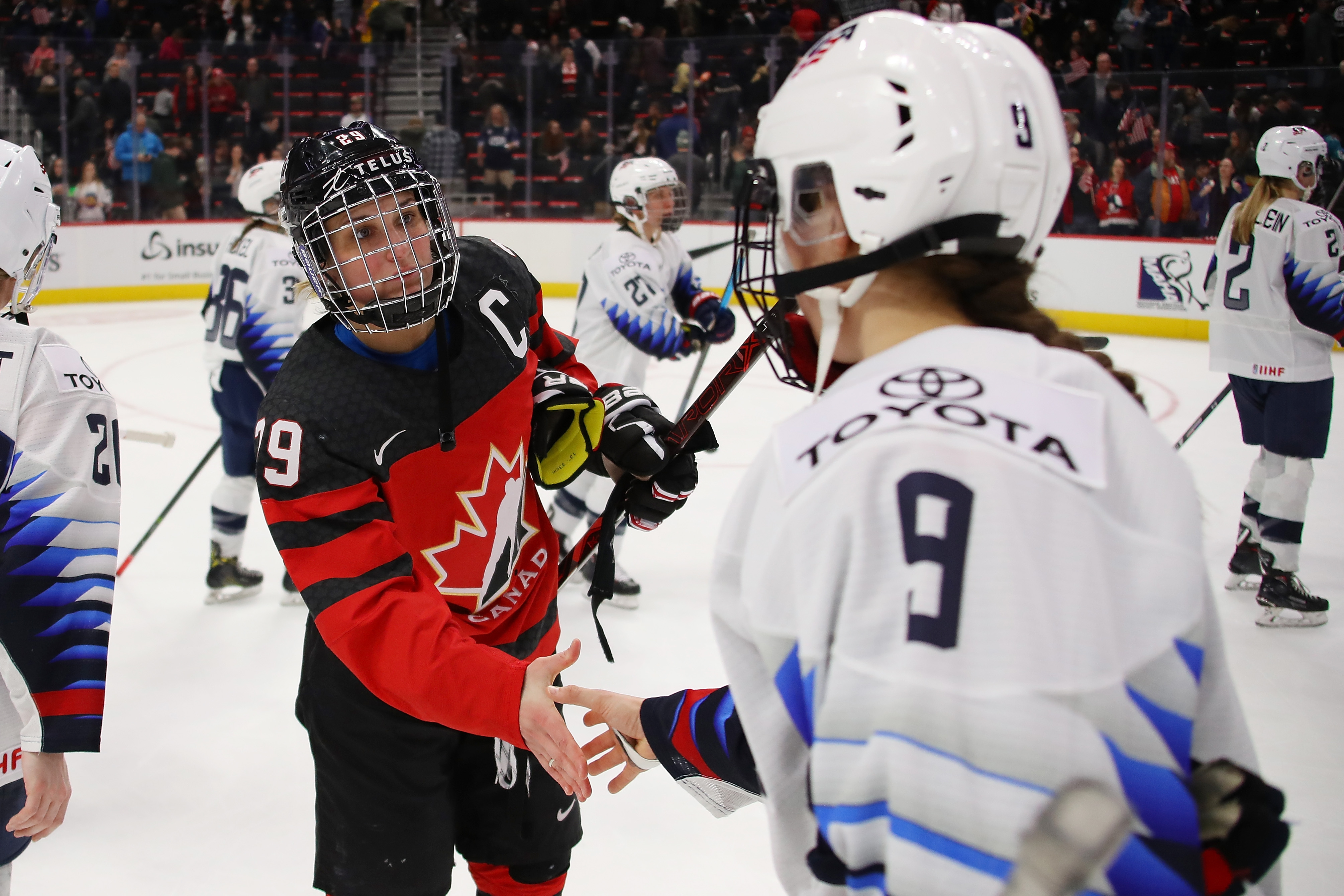 Marie-Philip Poulin #29 of Canada shakes hands with Megan Bozek #9 of the United States after a 2-0 Canada win at Little Caesars Arena on February 17, 2019 in Detroit, Michigan.