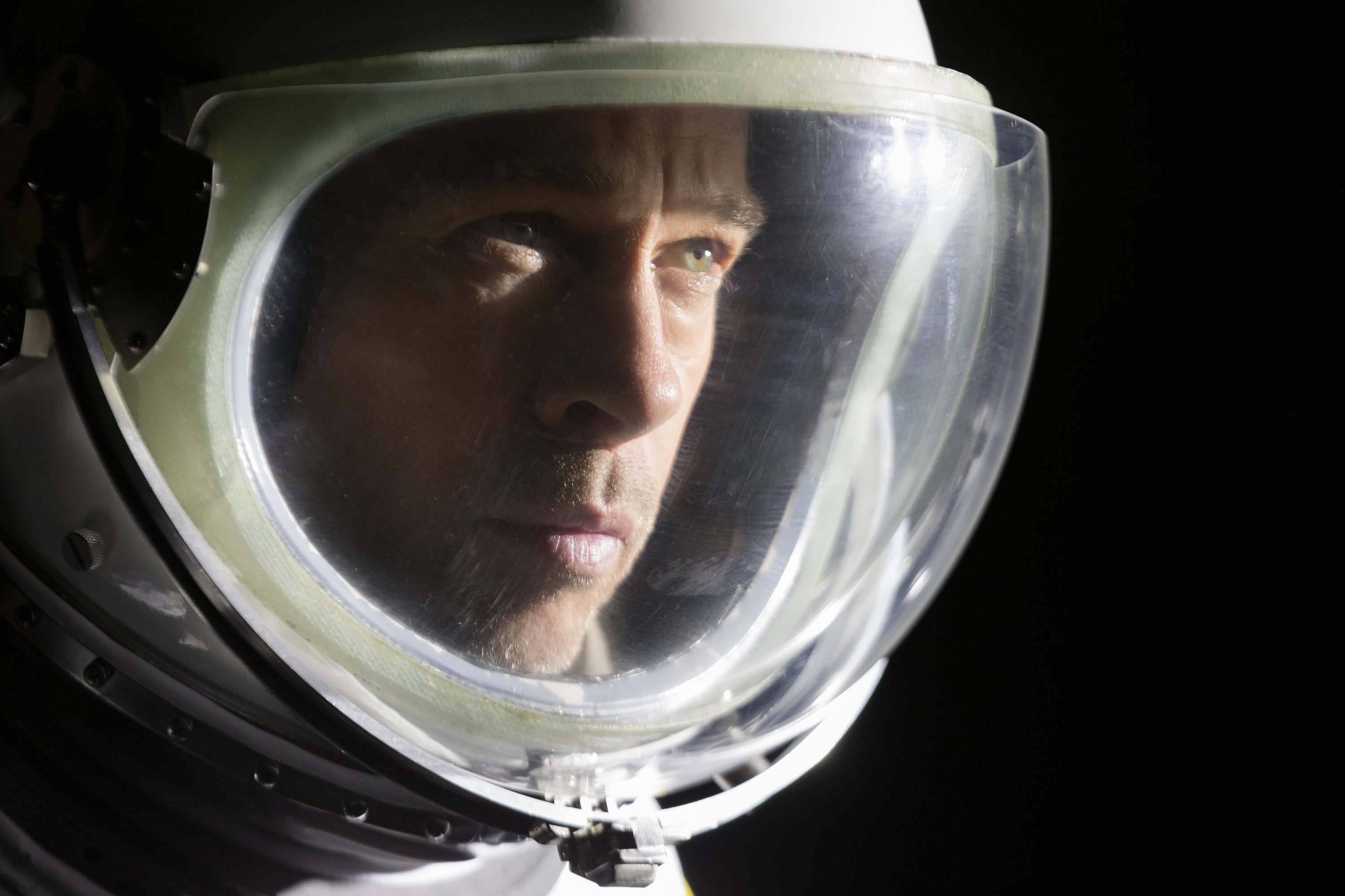 brad pitt as roy the astronaut floating through the blackness of space in ad astra