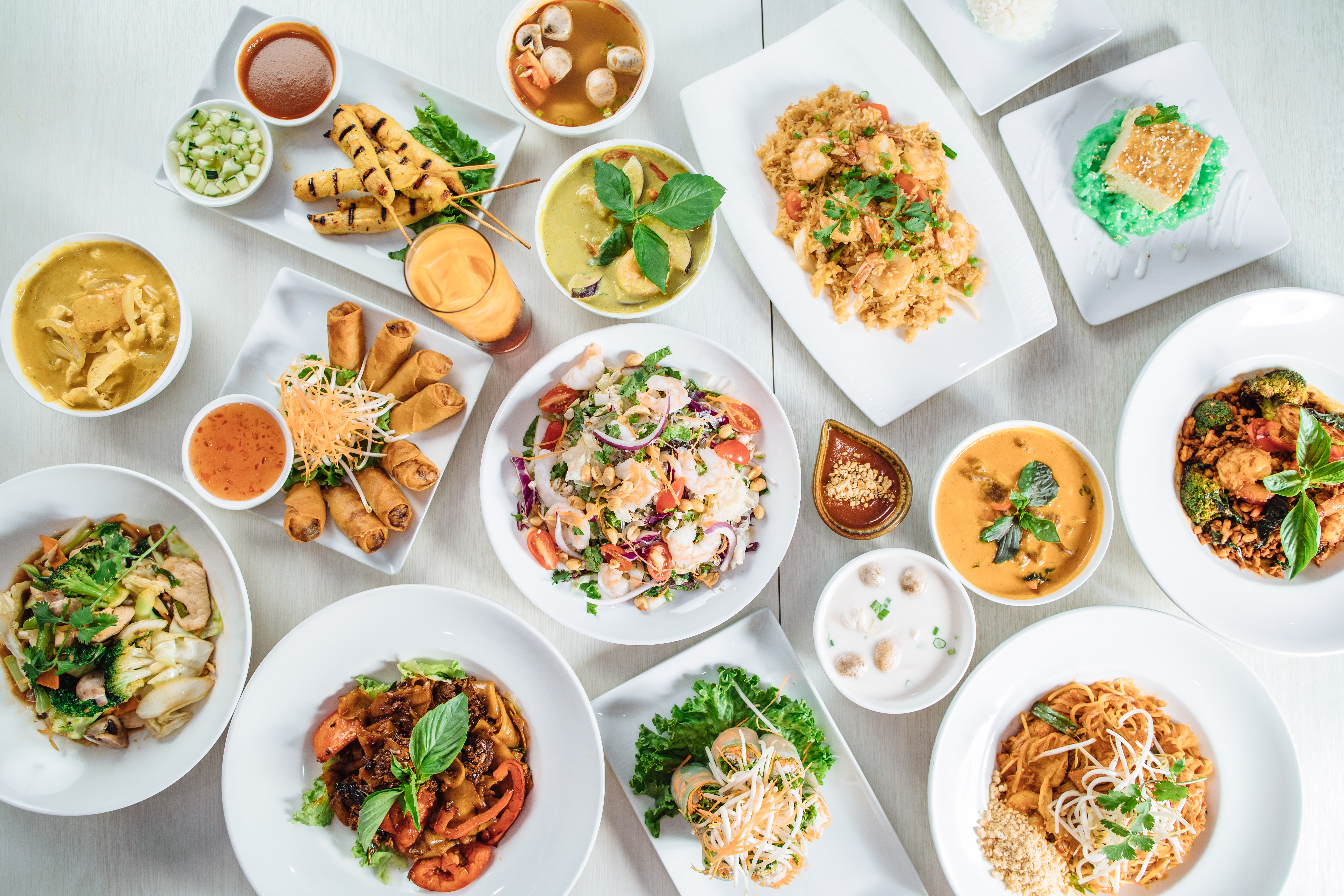 A spread of Thai noodle dishes and curries