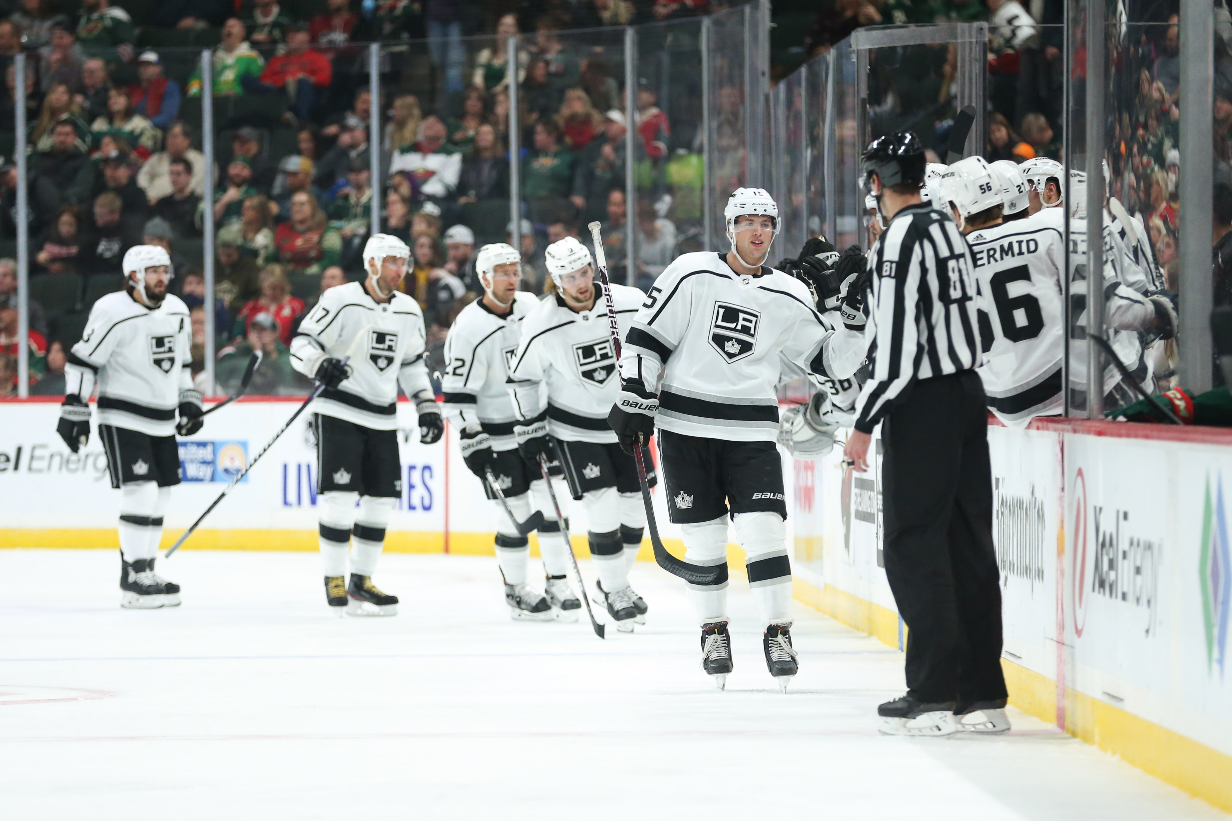 Los Angeles Kings defenseman Ben Hutton (15) celebrates with teammates after scoring a goal against the Minnesota Wild during the second period at Xcel Energy Center.
