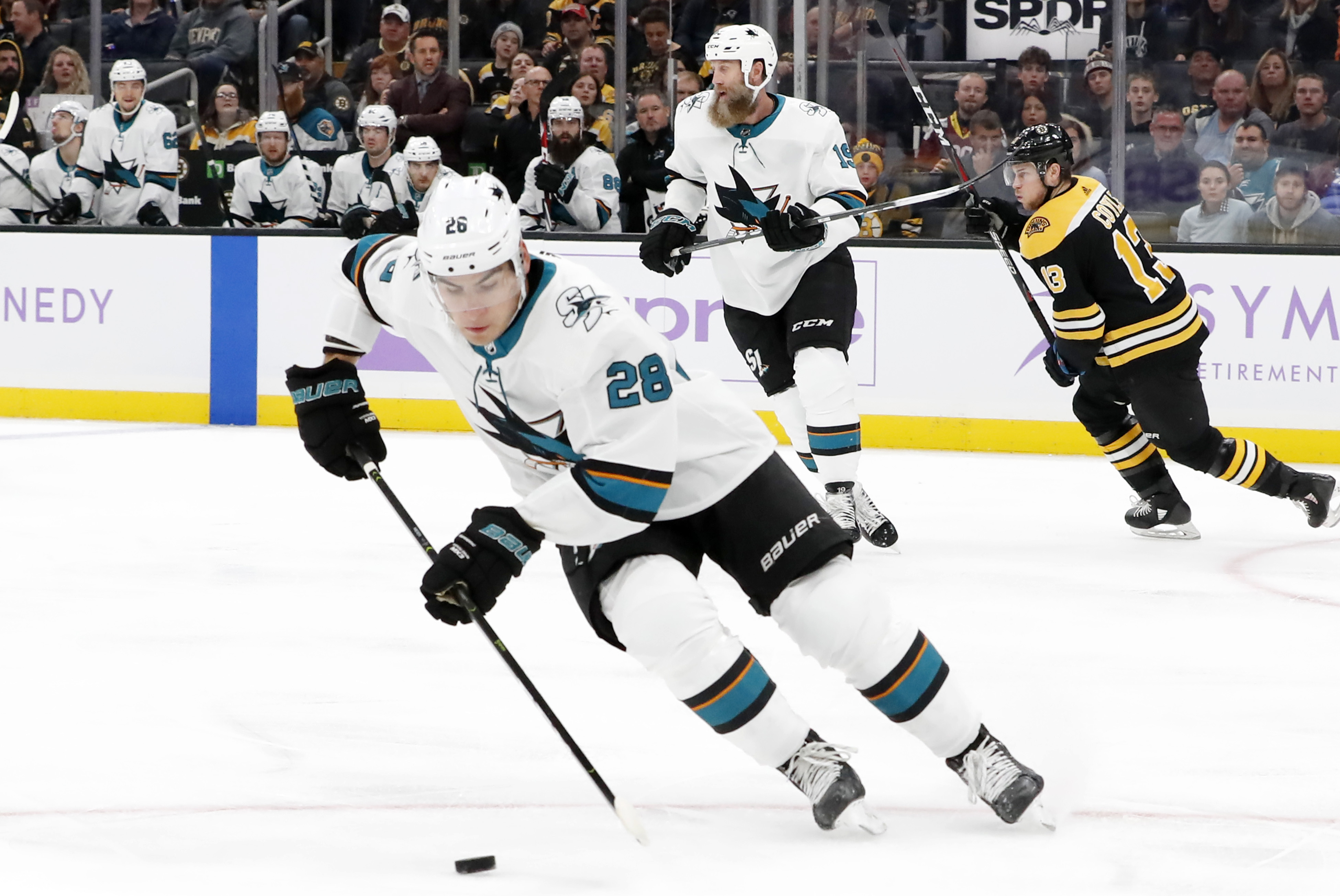 San Jose Sharks left wing Timo Meier (28) picks up the puck during a game between the Boston Bruins and the San Jose Sharks on October 29, 2019, at TD Garden in Boston, Massachusetts.