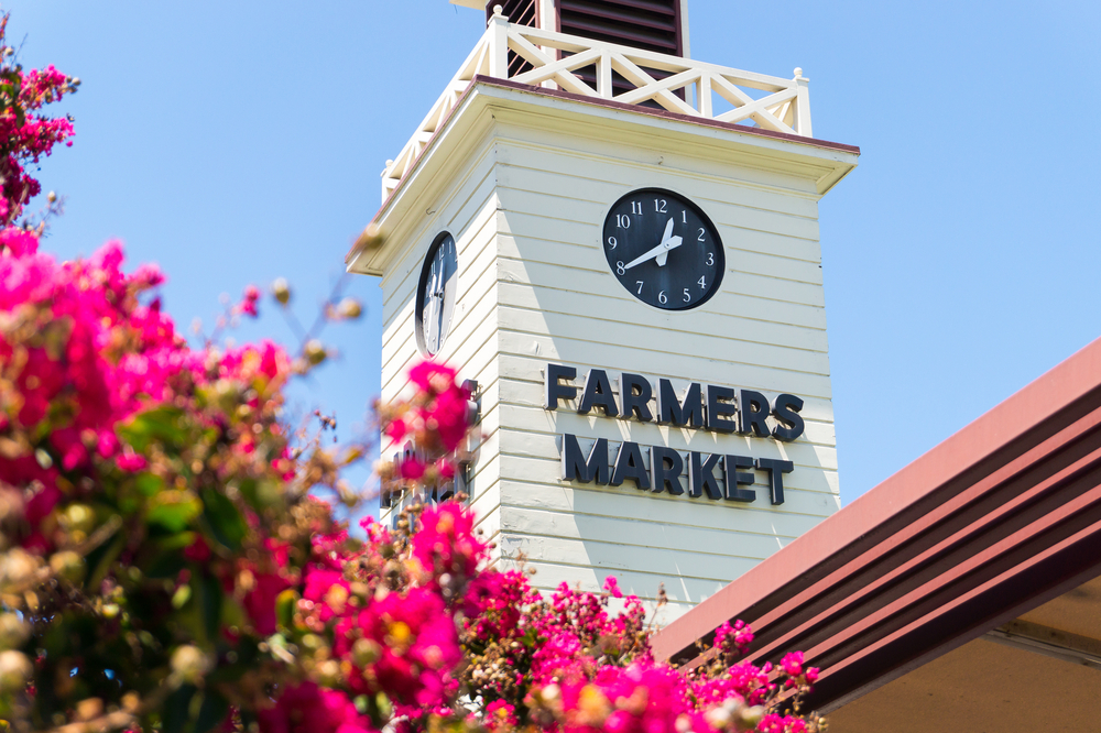 The Farmers Market tower in Los Angeles. The market area offers over a hundred vendors and is open seven days a week.
