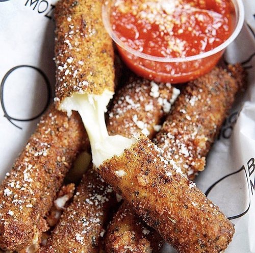 Mozzarella stick with melted cheese.