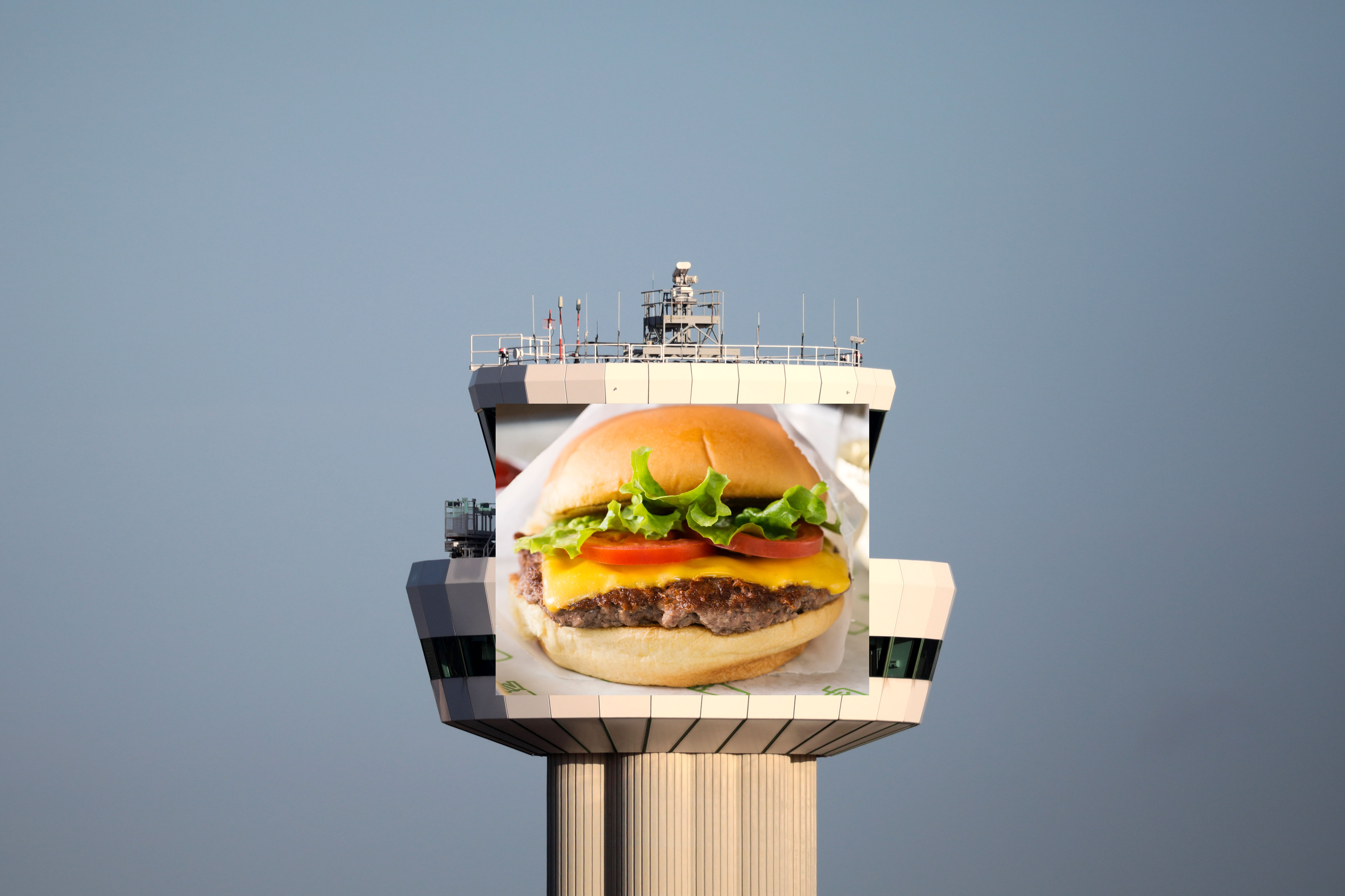A Shake Shack logo photoshopped on to the control tower at Gatwick Airport in London