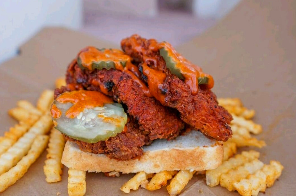 The Nashville hot chicken tenders sandwich served on white bread at newly opened restaurant, The Hot Clucker.