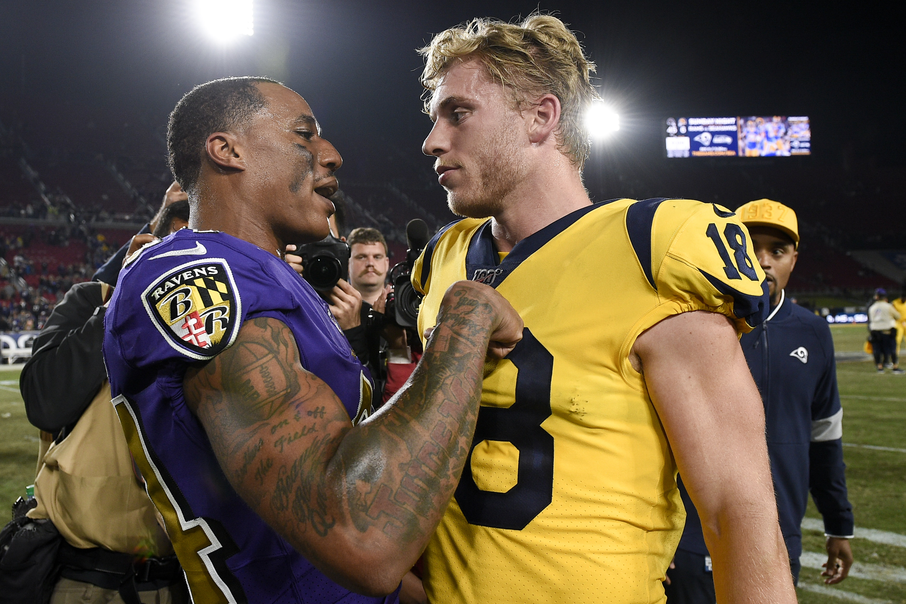 Baltimore Ravens CB Marcus Peters and Los Angeles Rams WR Cooper Kupp share a moment after the Rams’ blowout loss in Week 12, Nov. 25, 2019.