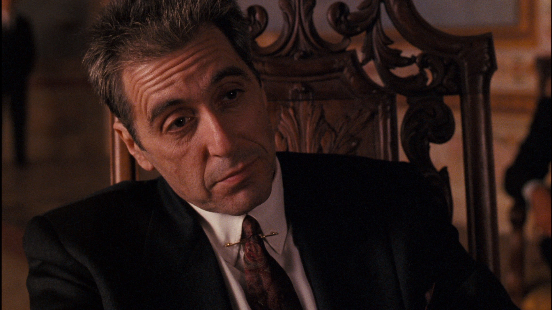 al pacino sits back as Michael Corleone in the godfather part 3
