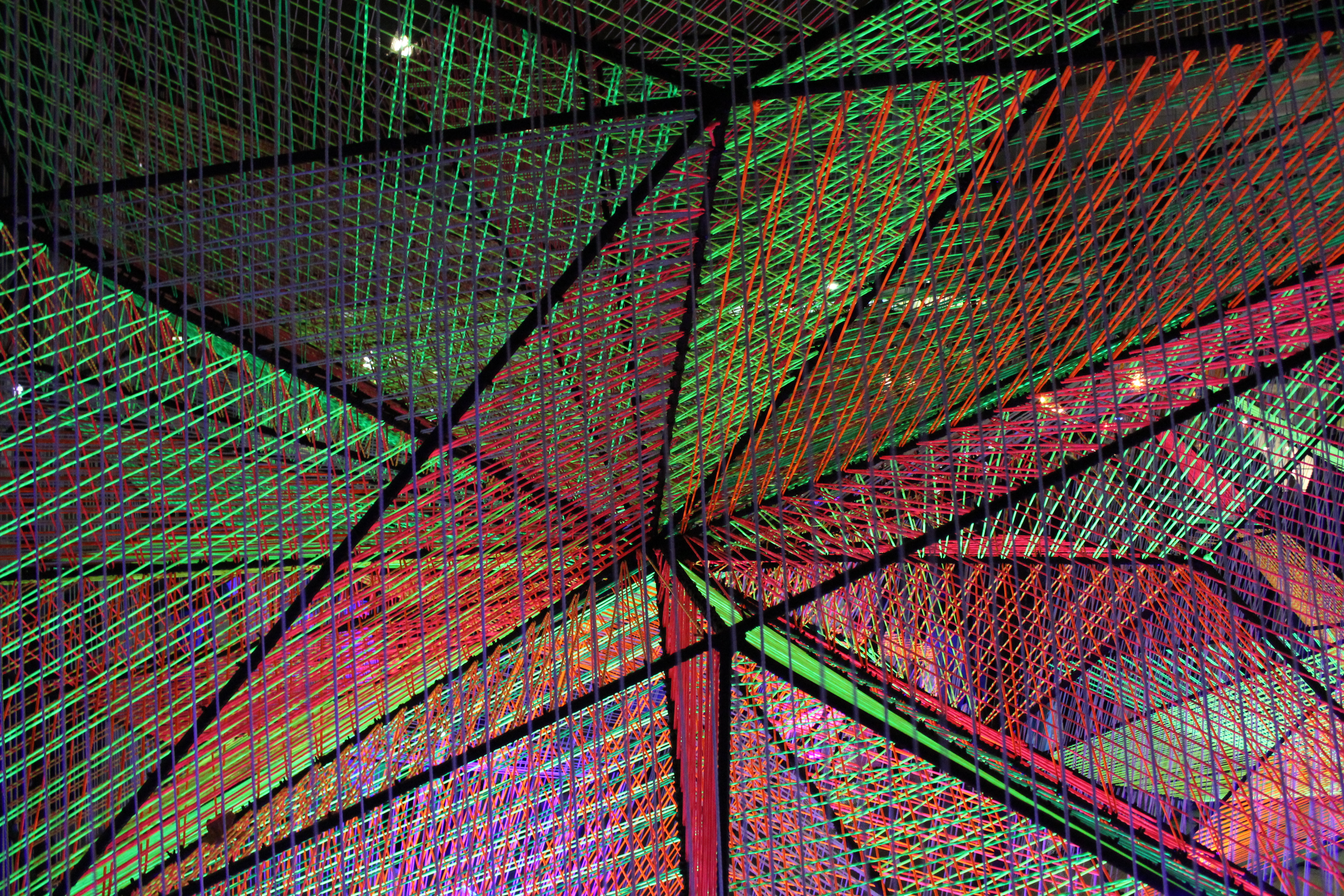 A light display with red and green threads in a mesh structure.