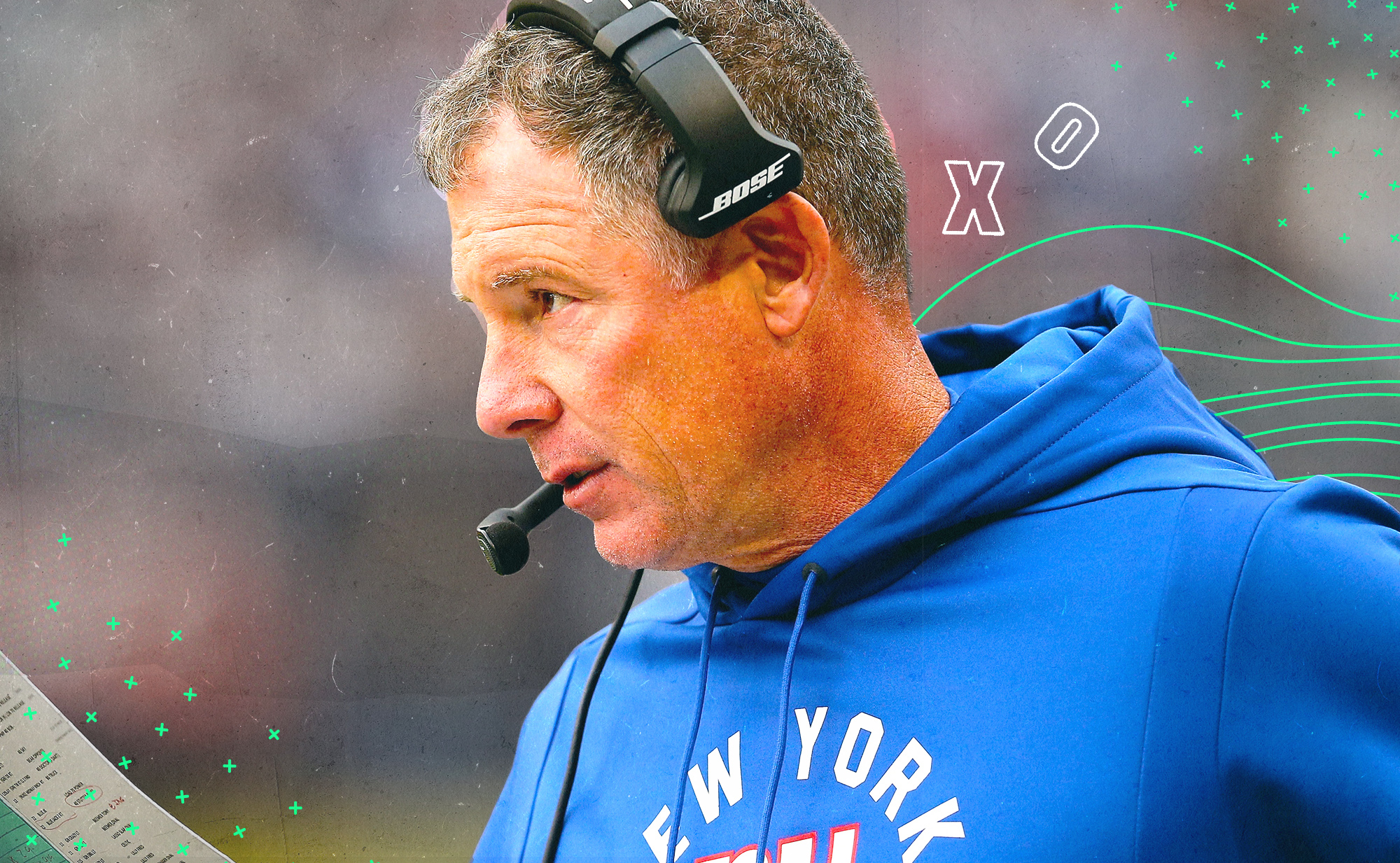 Side profile of Giants coach Pat Shurmur, wearing a headset, with white X’s and O’s in the background 