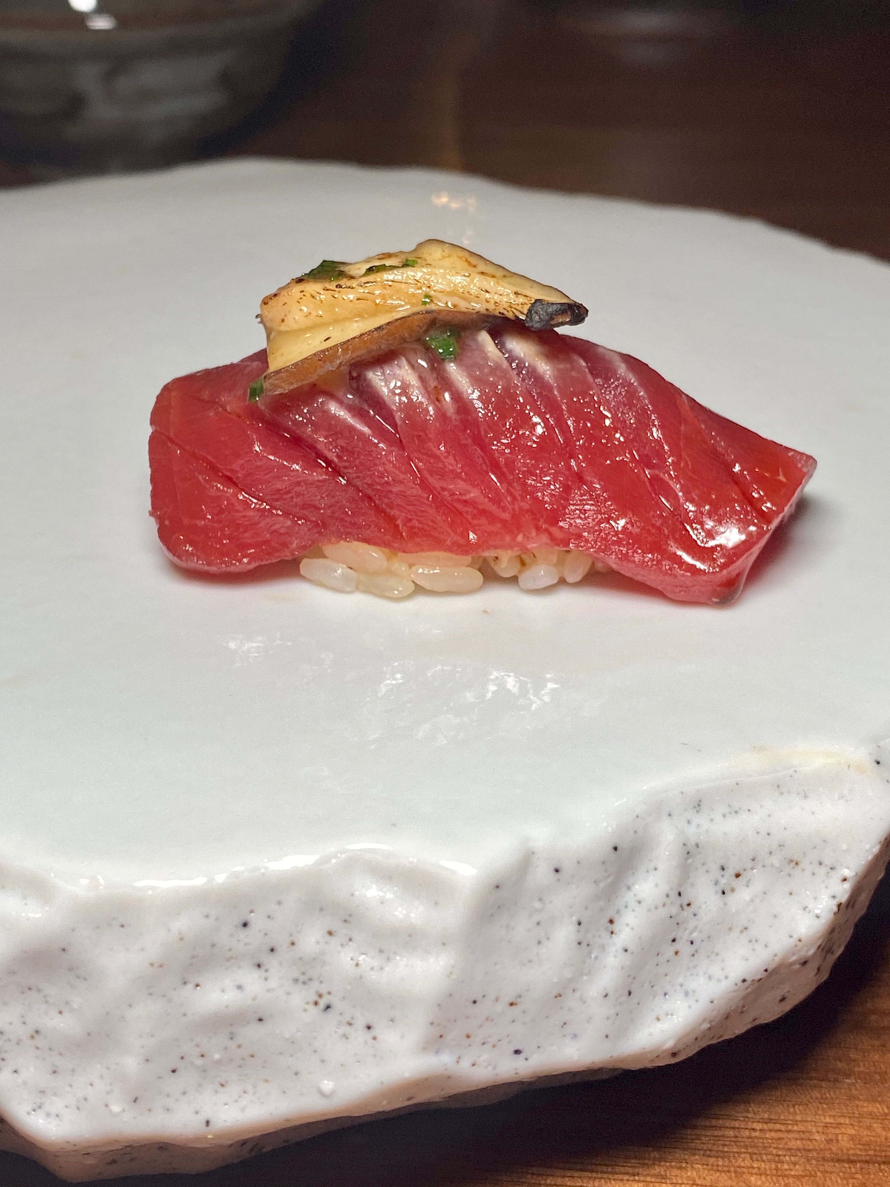 a piece of tuna nigiri at kissaki