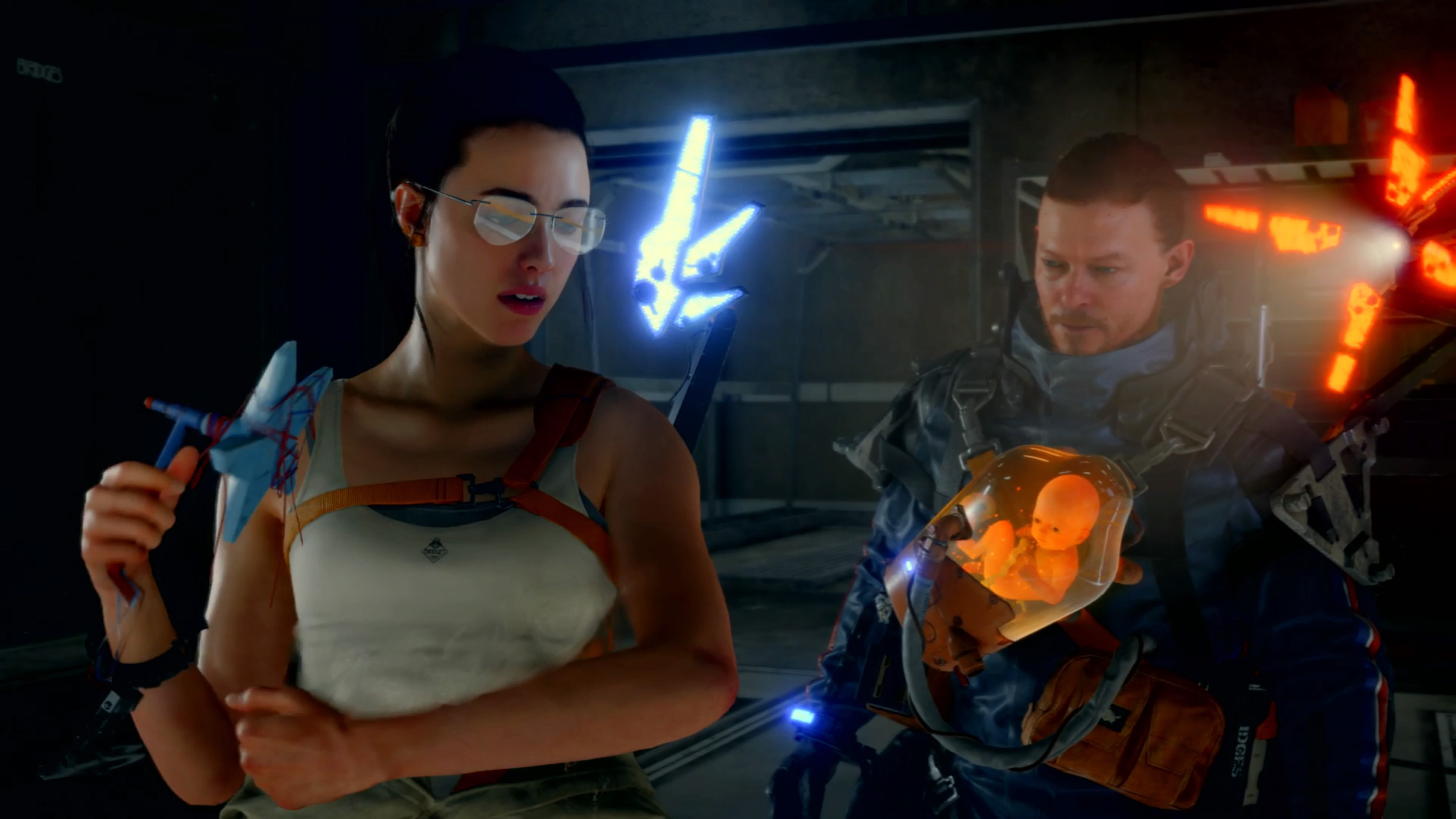 a young woman in a white tank top and glasses stands next to a man with a baby strapped to his chest in Death Stranding