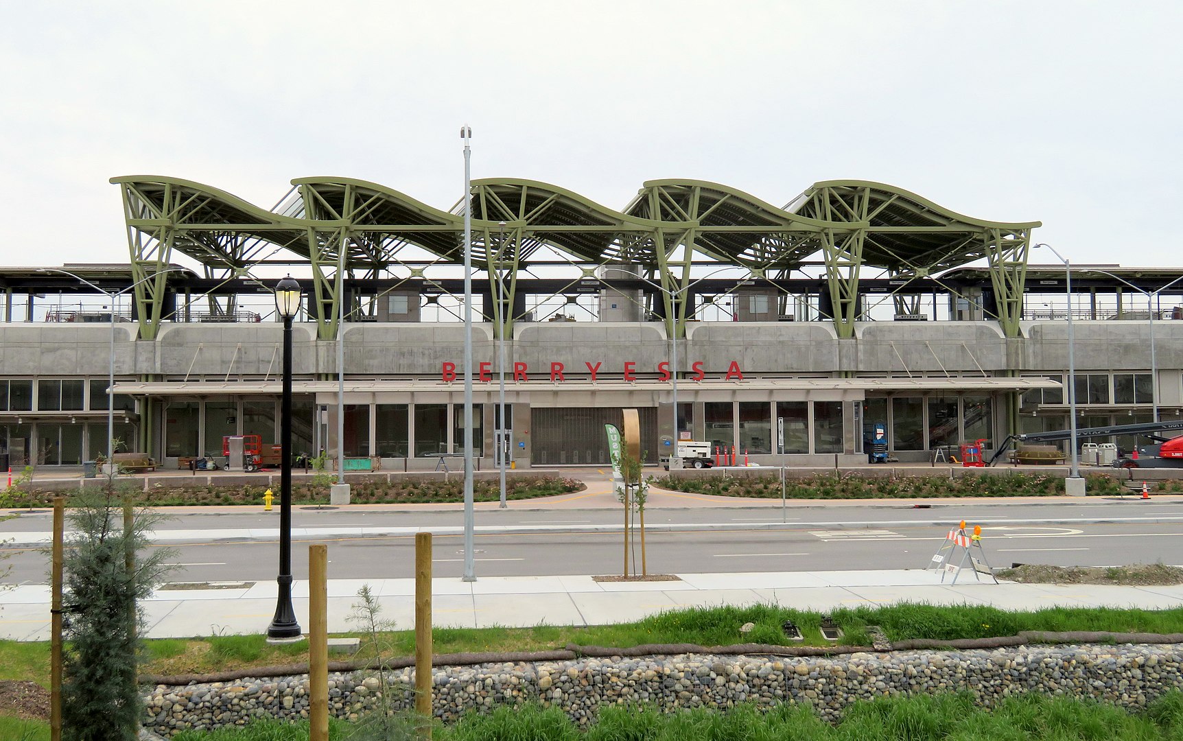 An under-construction train station, with red lettering reading “Berryessa.”