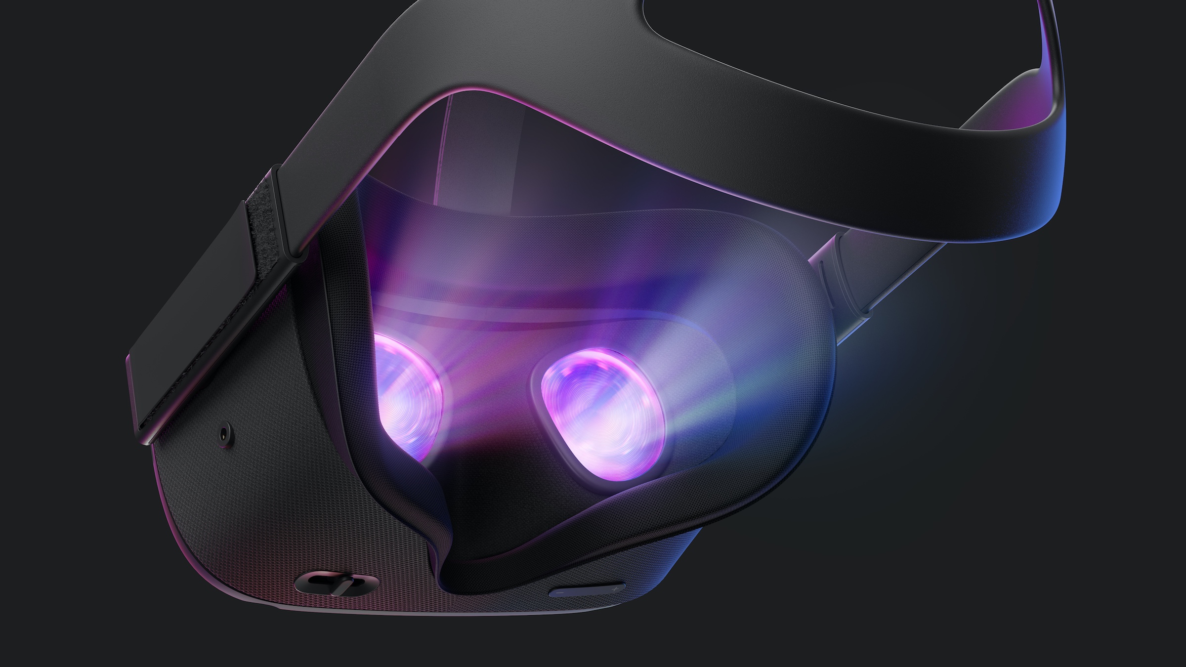 Product photo of the Oculus Quest VR headset with glowing lenses