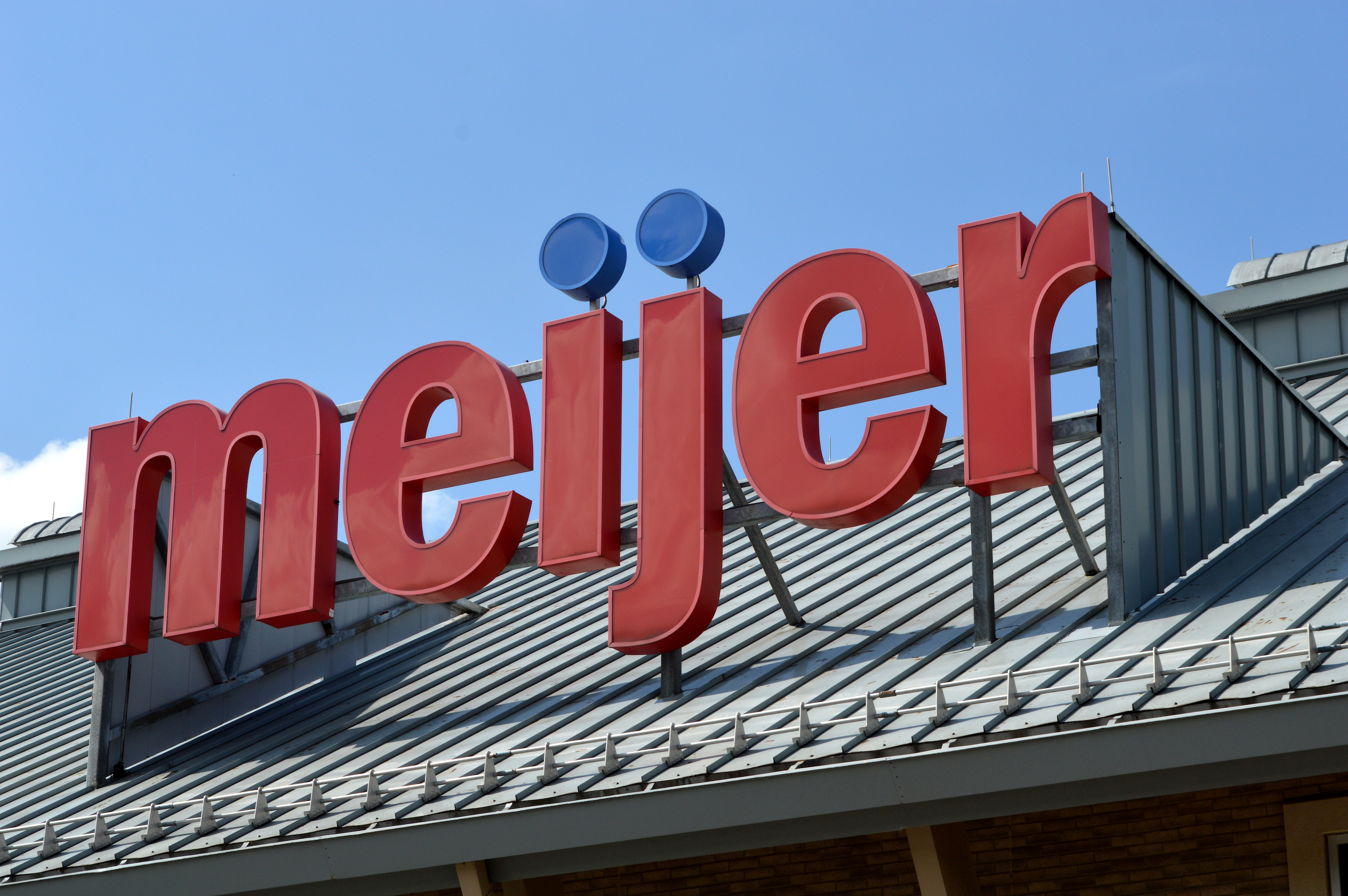 A closeup of a large, red “Meijer” sign.