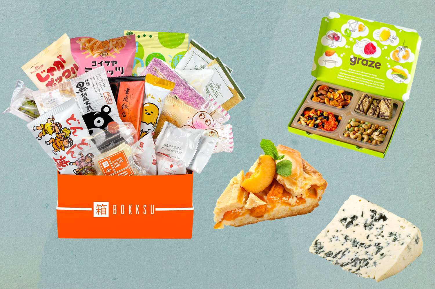 An open Bokksu box, Graze box, and slice of pie and slice of cheese.