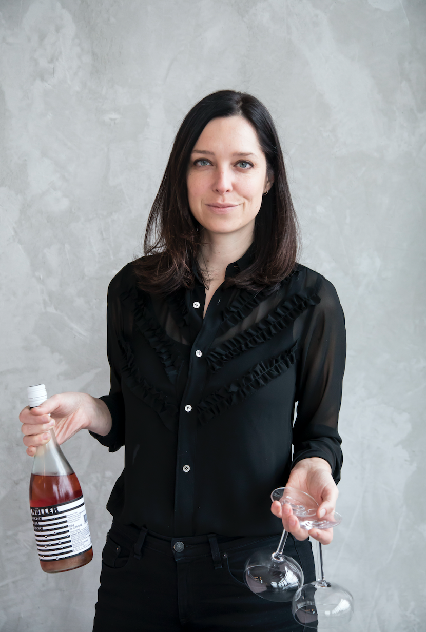 Chef and restaurateur Julia Jaksic holding wine