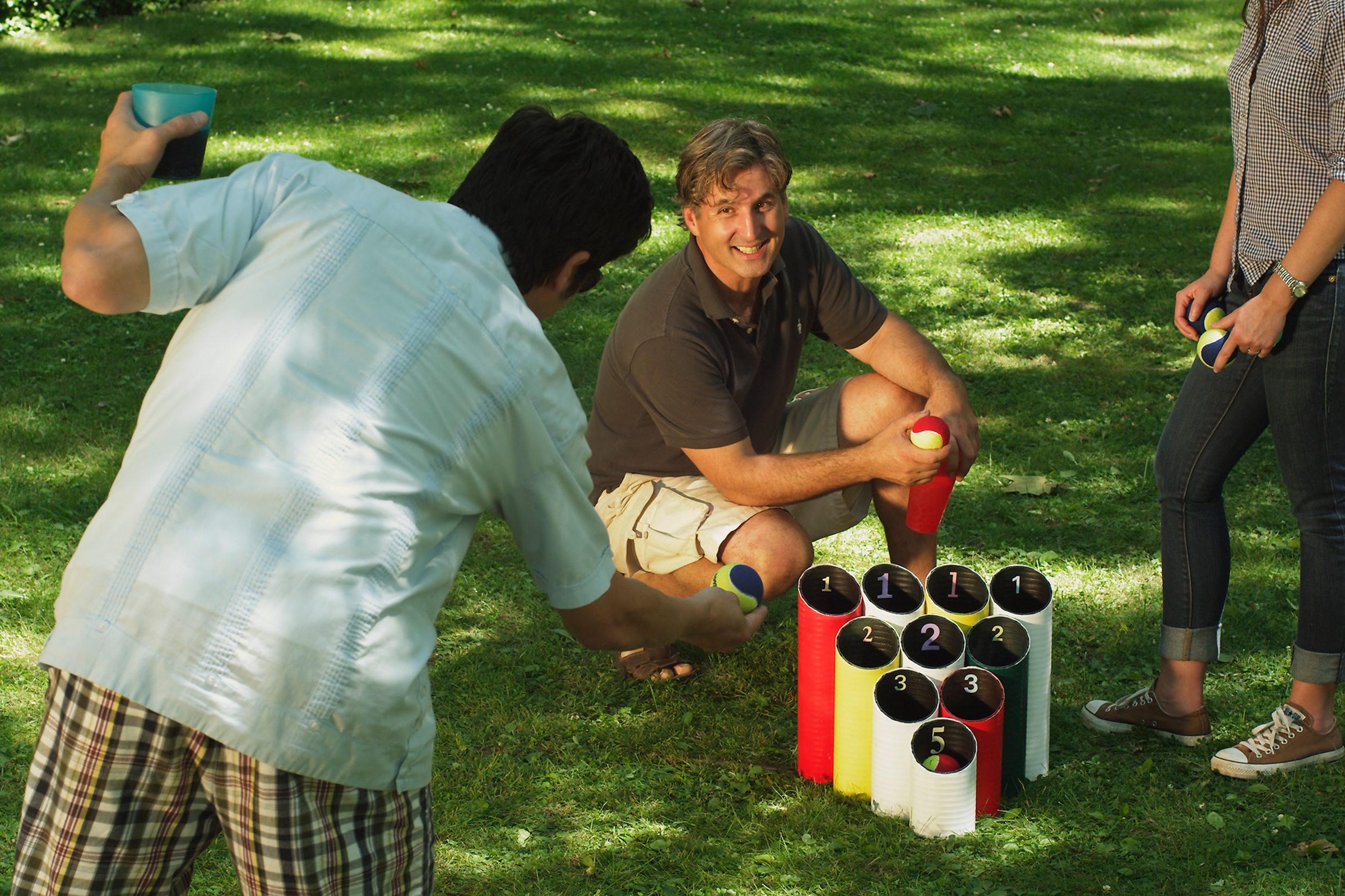Group of friends playing a pipe ball lawn game