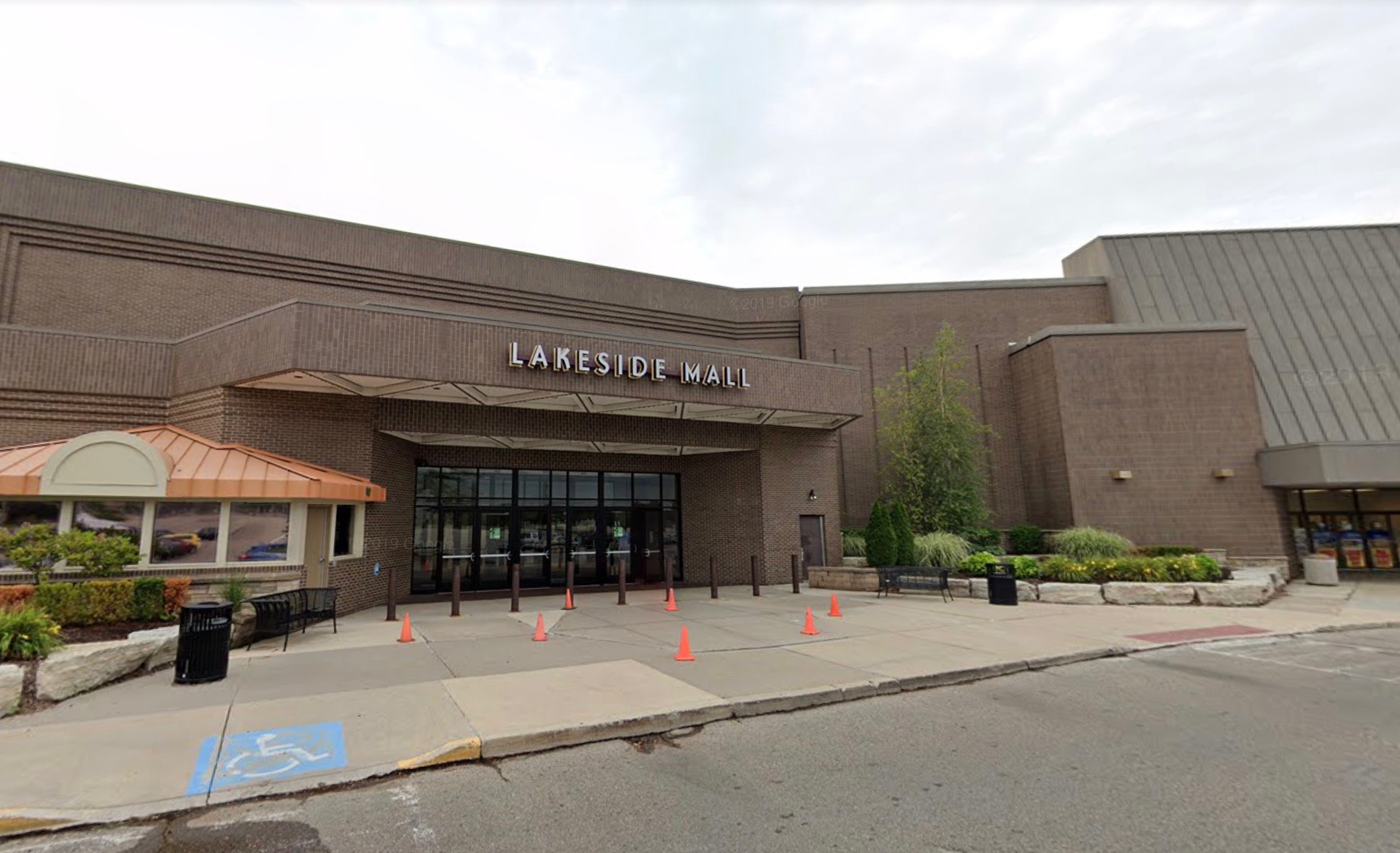 Exterior of a low brick building. “Lakeside Mall” is written outside the front in block letters.