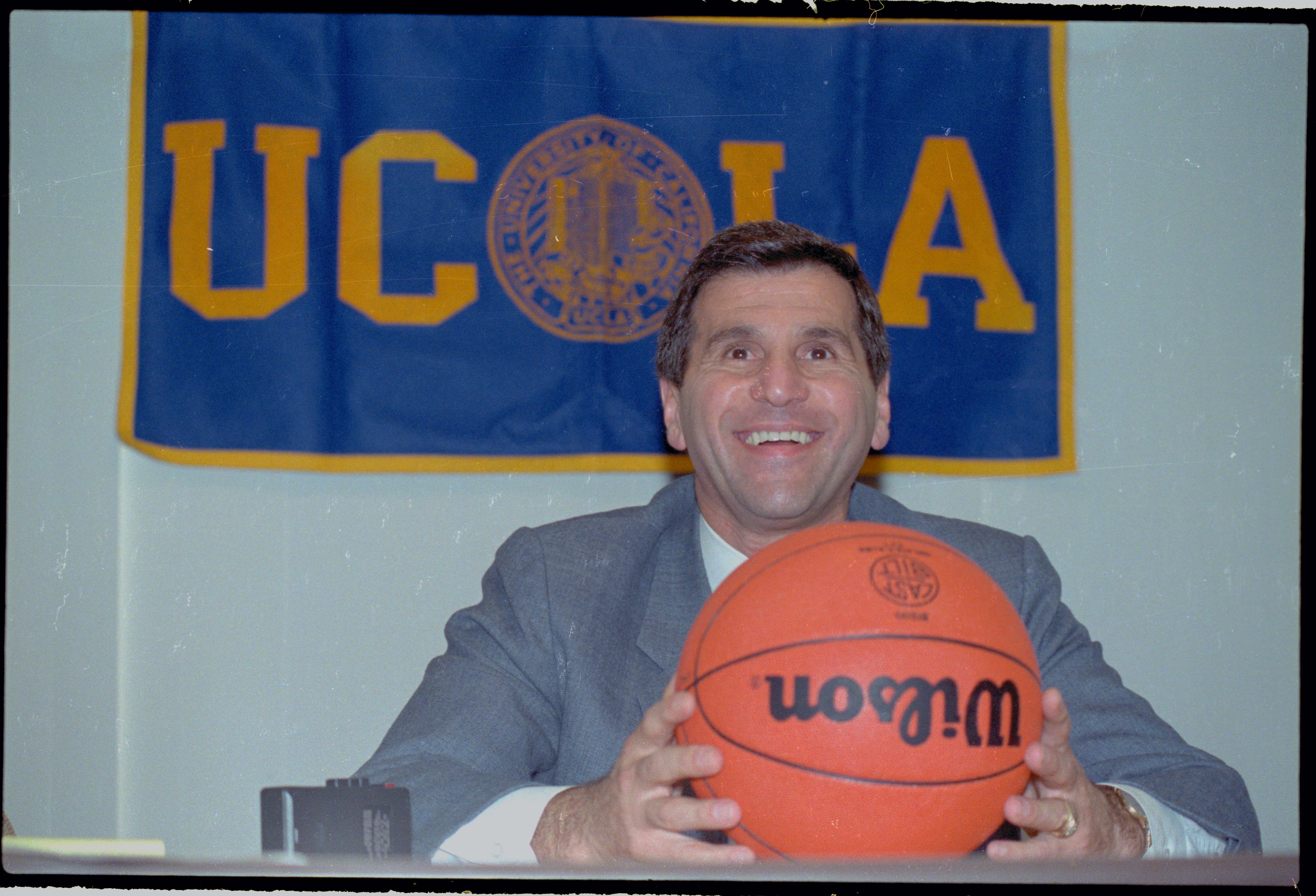 Jim Harrick Posing with Basketball