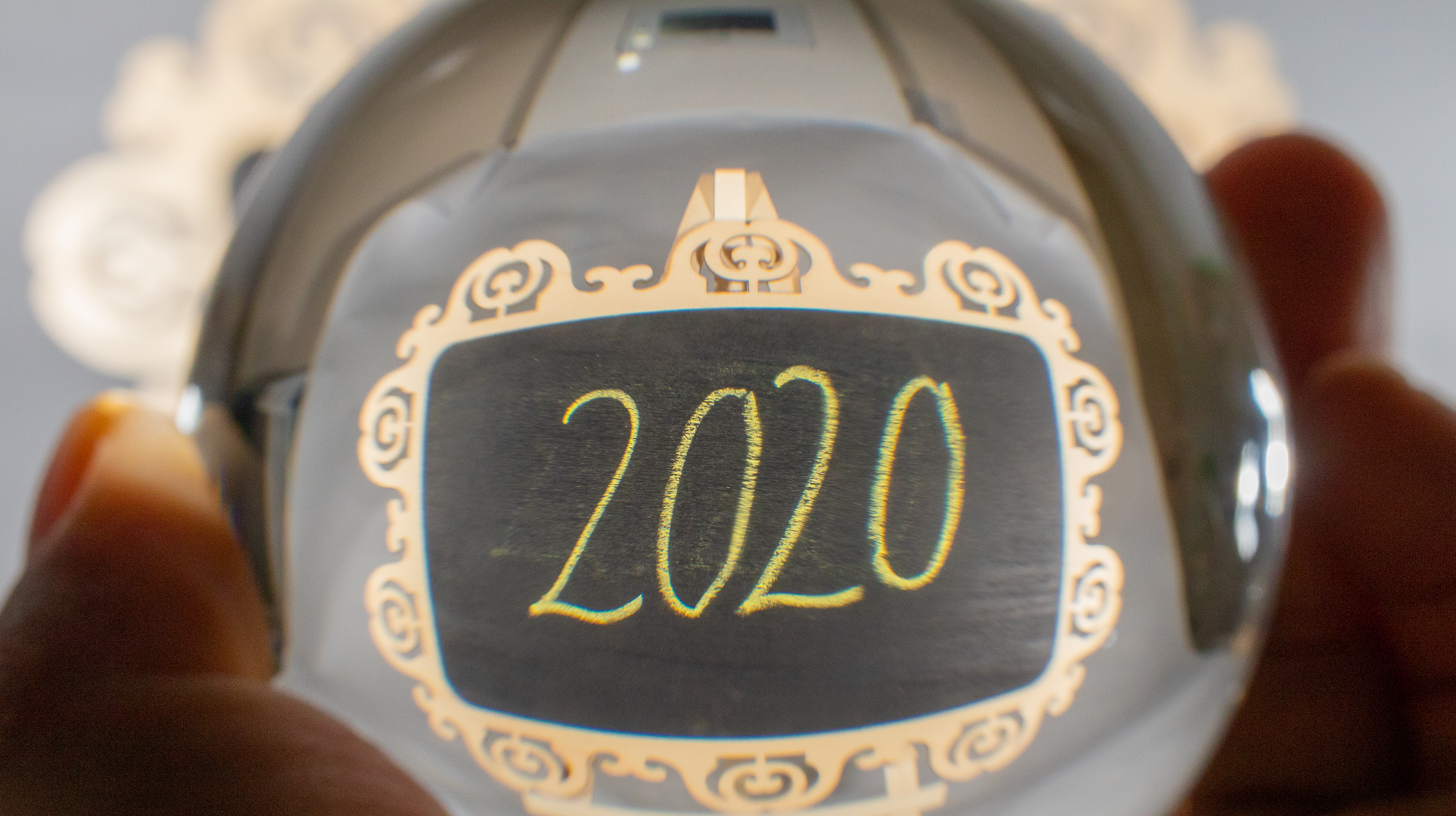 A crystal ball with a reflection of the year 2020
