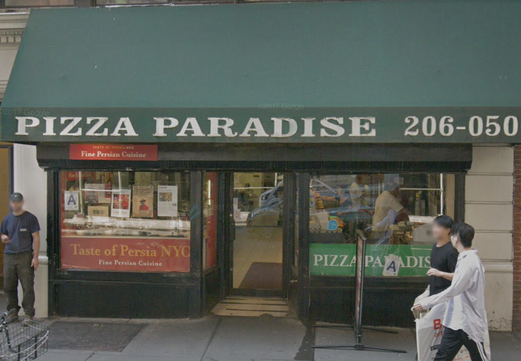 The exterior of the Persian restaurant Taste of Persia tucked into a pizzeria with a green awning. Taste of Persia has red signage out front.