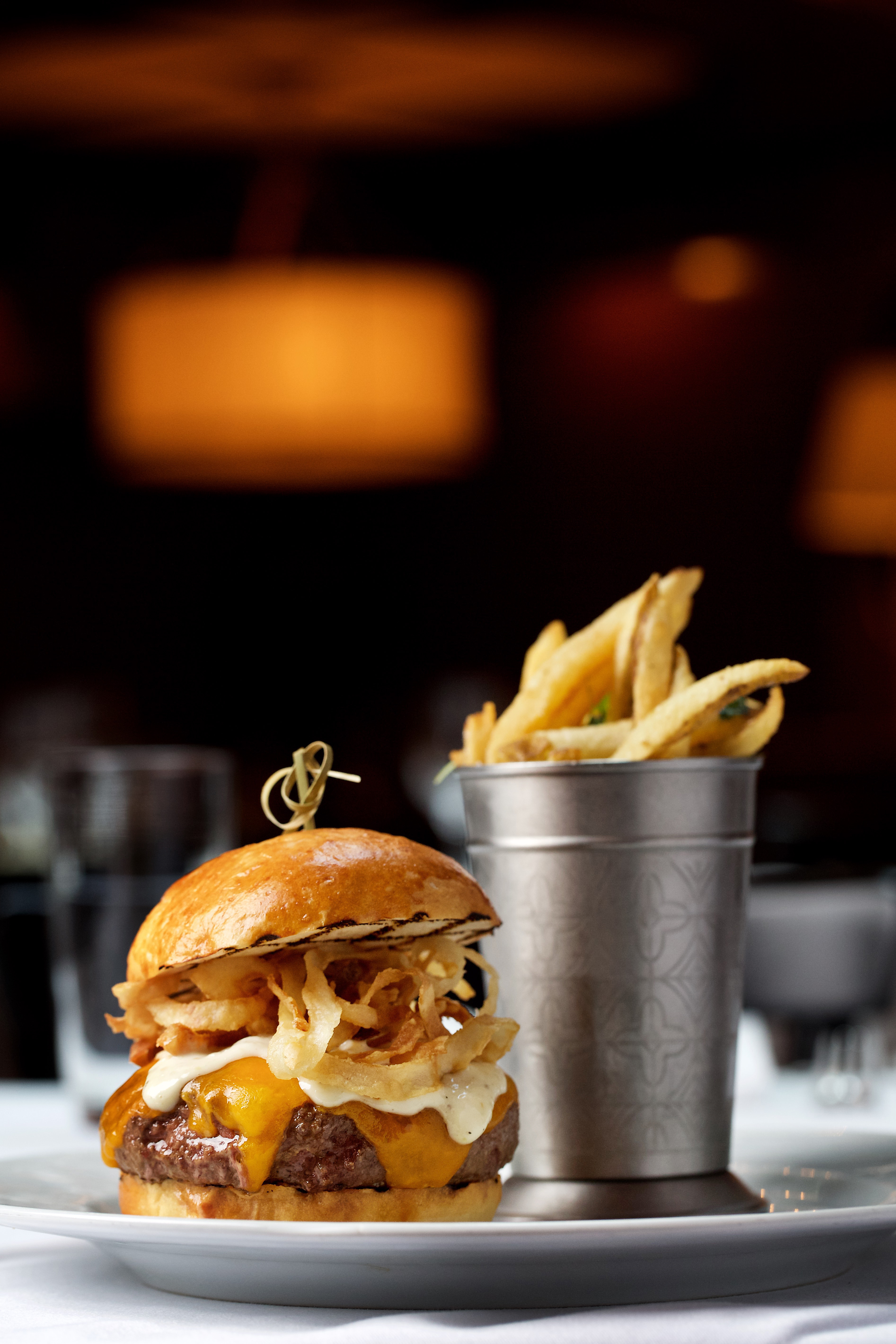 A Schlow Burger with cheddar, horseradish, and crispy onions from the Riggsby