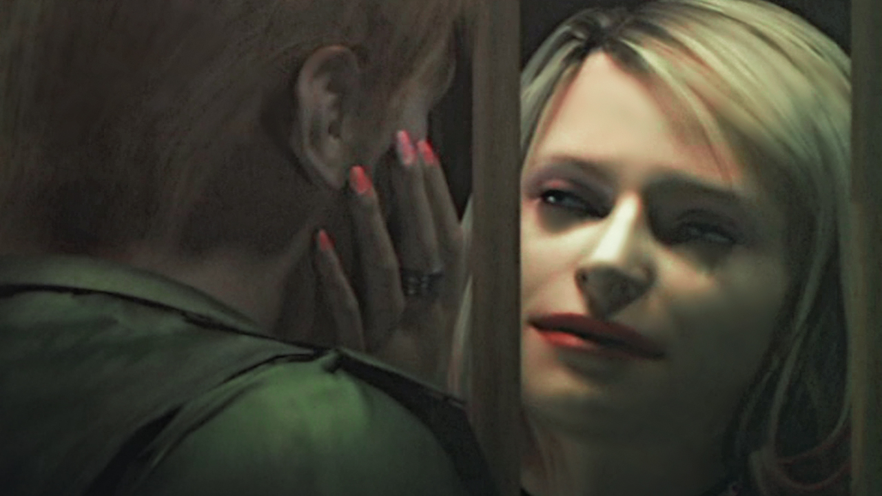 A woman looks into James Sunderland’s eyes while holding his head in her hands in a screenshot from the original Silent Hill 2.
