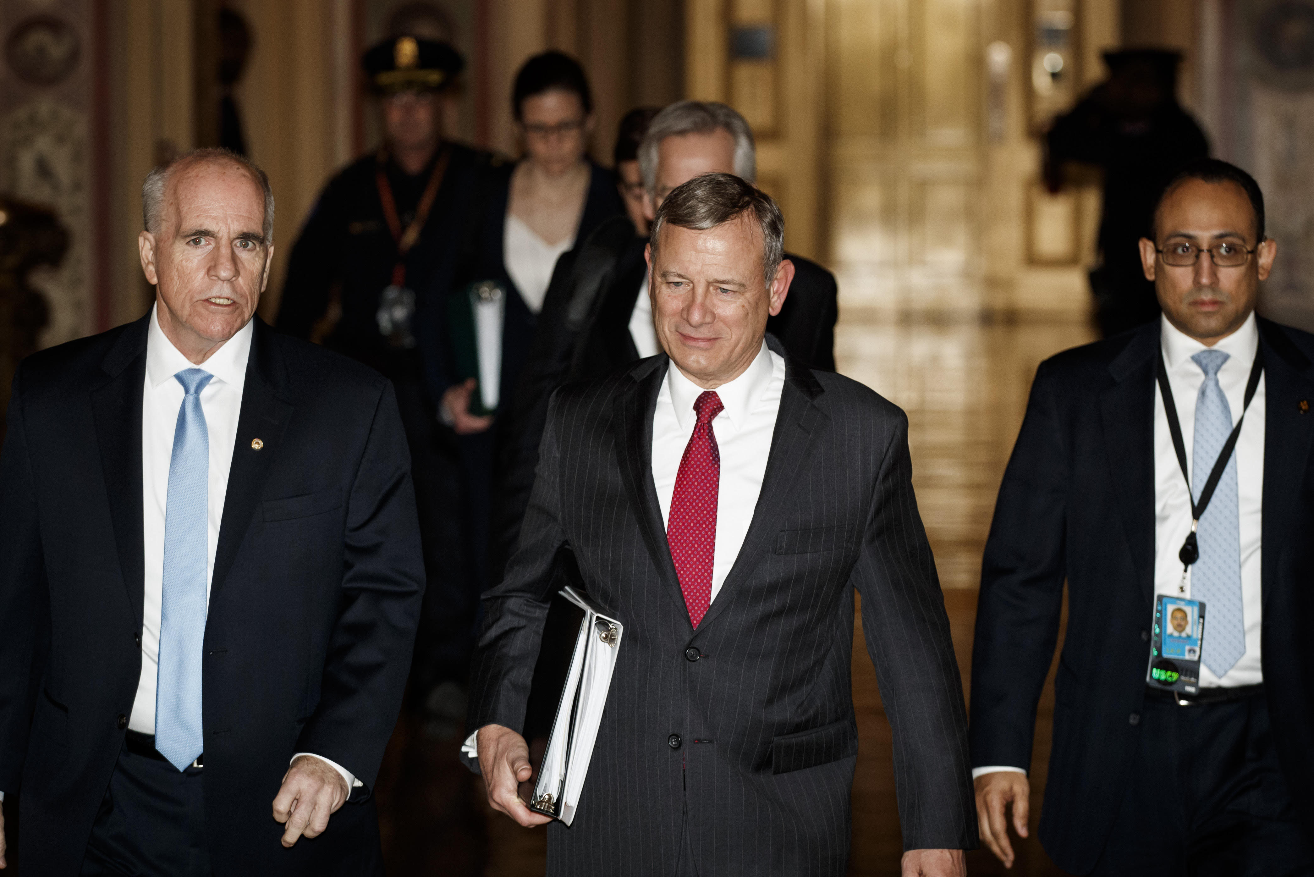 Chief Justice John Roberts walks through the halls of the U.S. Senate after swearing in for the Senate impeachment trial against President Donald Trump, in Washington, DC, on January 16, 2020.