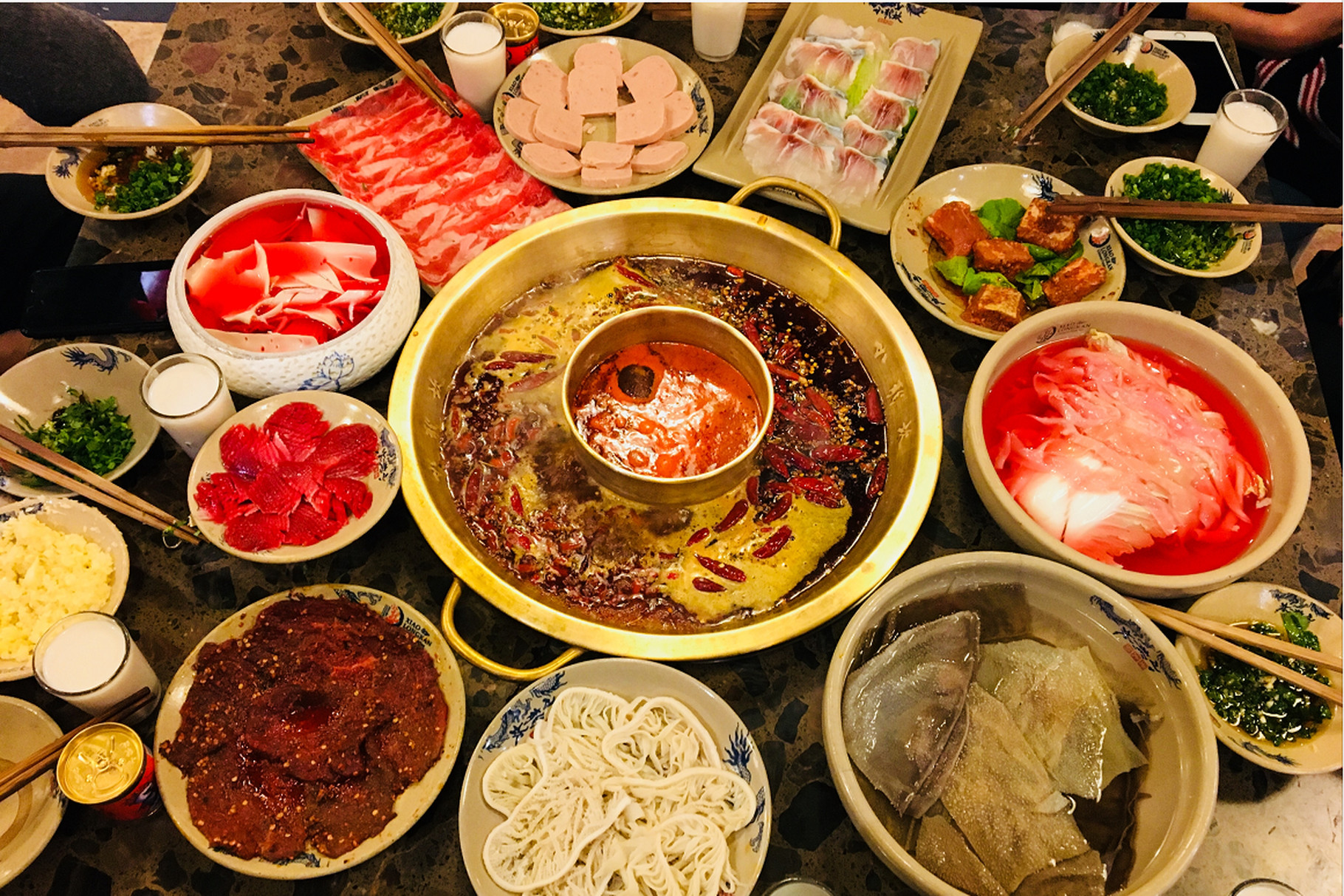 A spread of Chinese food dishes on a table.