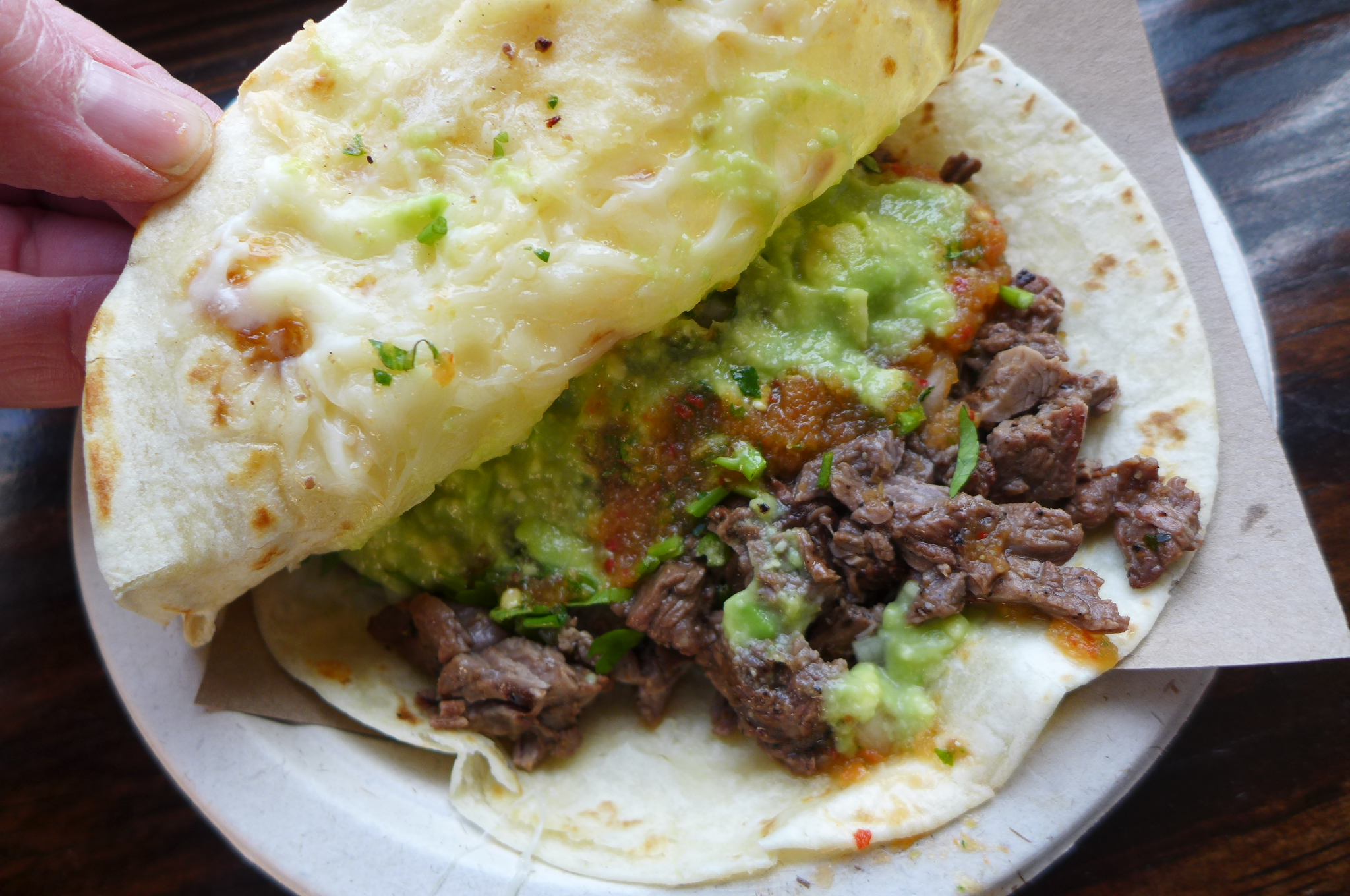 A flour gringa, like a quesadilla with cheese and grilled beef inside.