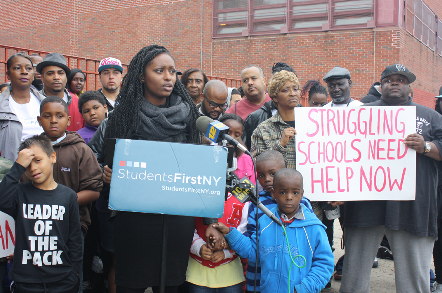 Tenicka Boyd, an organizer for StudentsFirstNY, spoke at a rally outside Boys and Girls High School in Brooklyn.