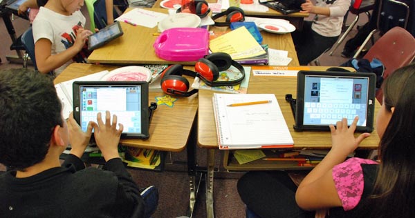 Students at Lumberg Elementary School in Jefferson County work on their assigned iPads during a class project. Photo by Nicholas Garcia