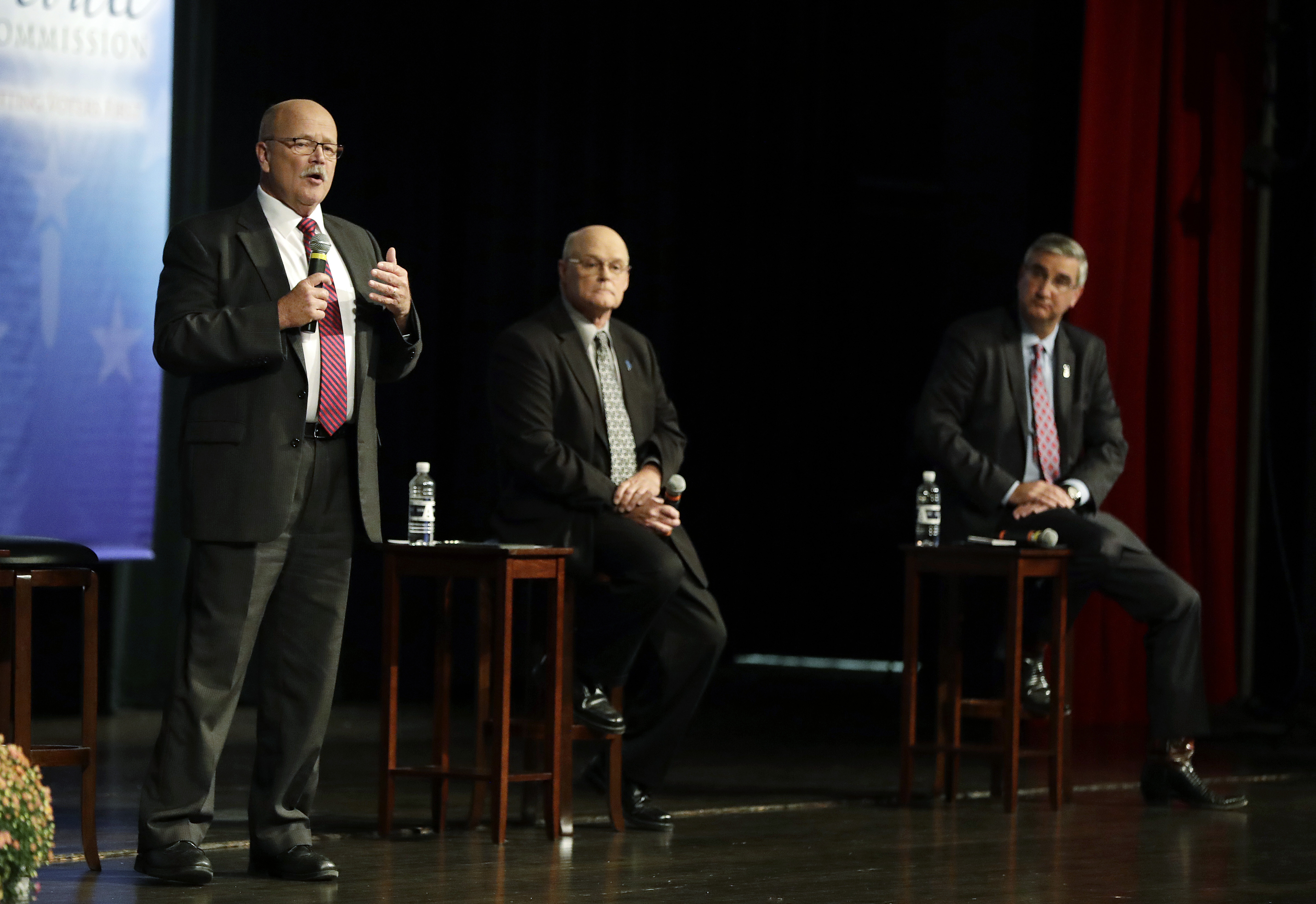 Democrat John Gregg, left,  responds to a question during a debate for Indiana Governor, Tuesday, Sept. 27, 2016, in Indianapolis. Libertarian Rex Bell and Republican Lt. Gov. Eric Holcomb also participated in the debate.