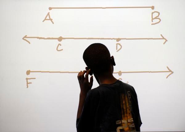 A Stedman Elementary student scratches his head as he considers a math problem.