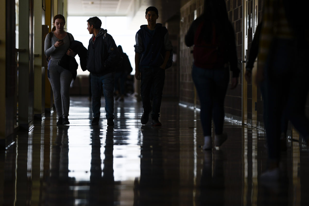 Students walk through the hall at Adams City High School between classes Monday, Feb. 4, 2019.