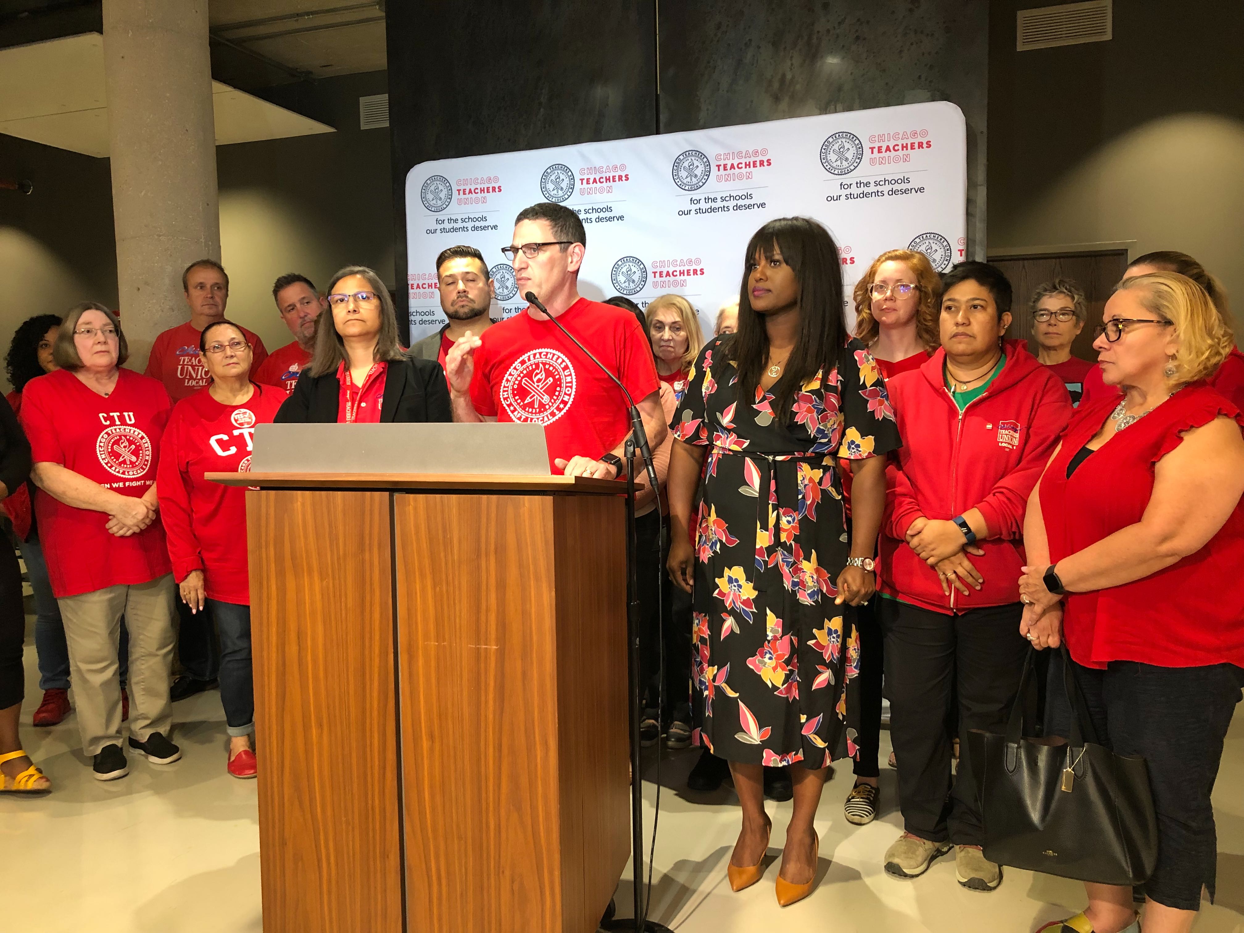 Chicago Teachers Union President Jesse Sharkey and Vice President Stacy Davis Gates announce the results of a strike vote Thursday night at union headquarters.