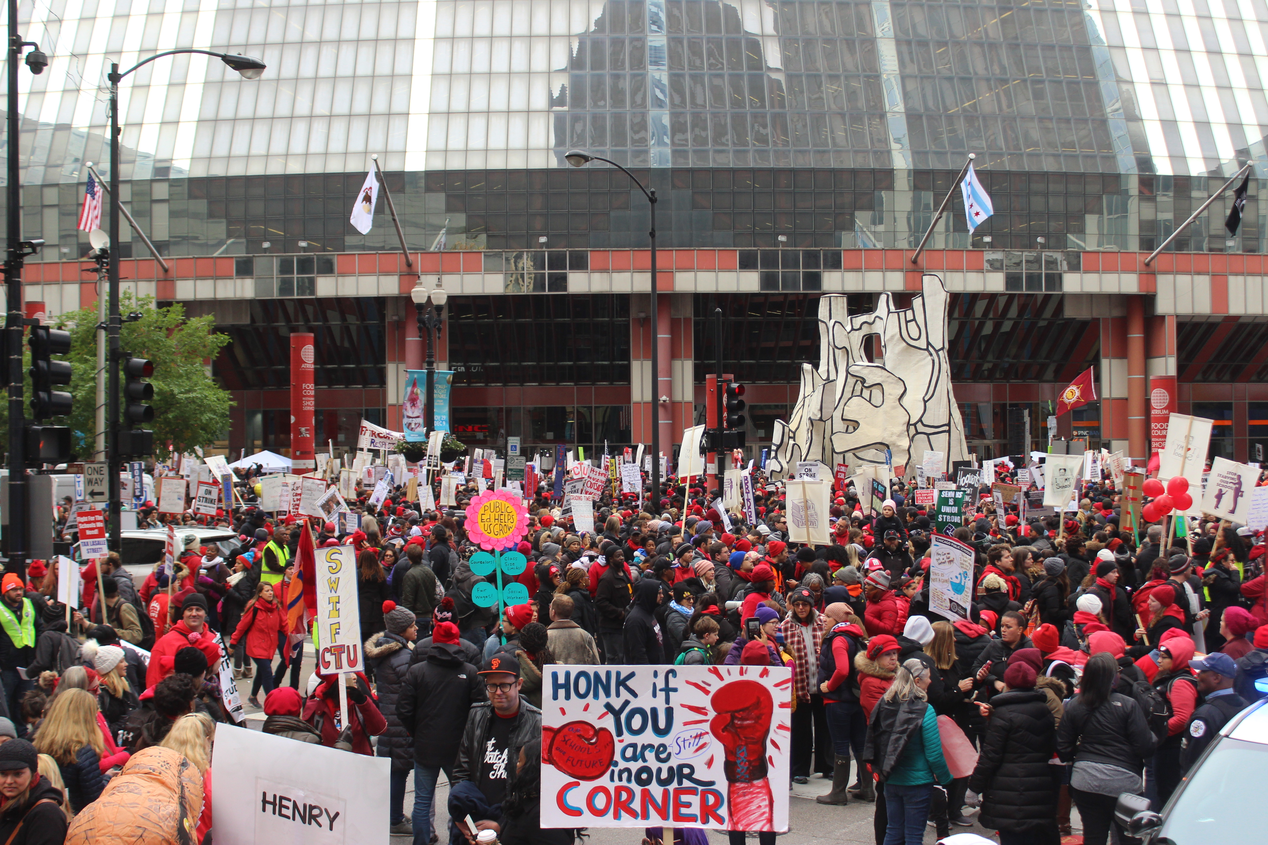 Teachers rally at the Thompson Center Wednesday during a massive gathering that union leaders said drew 30,000.