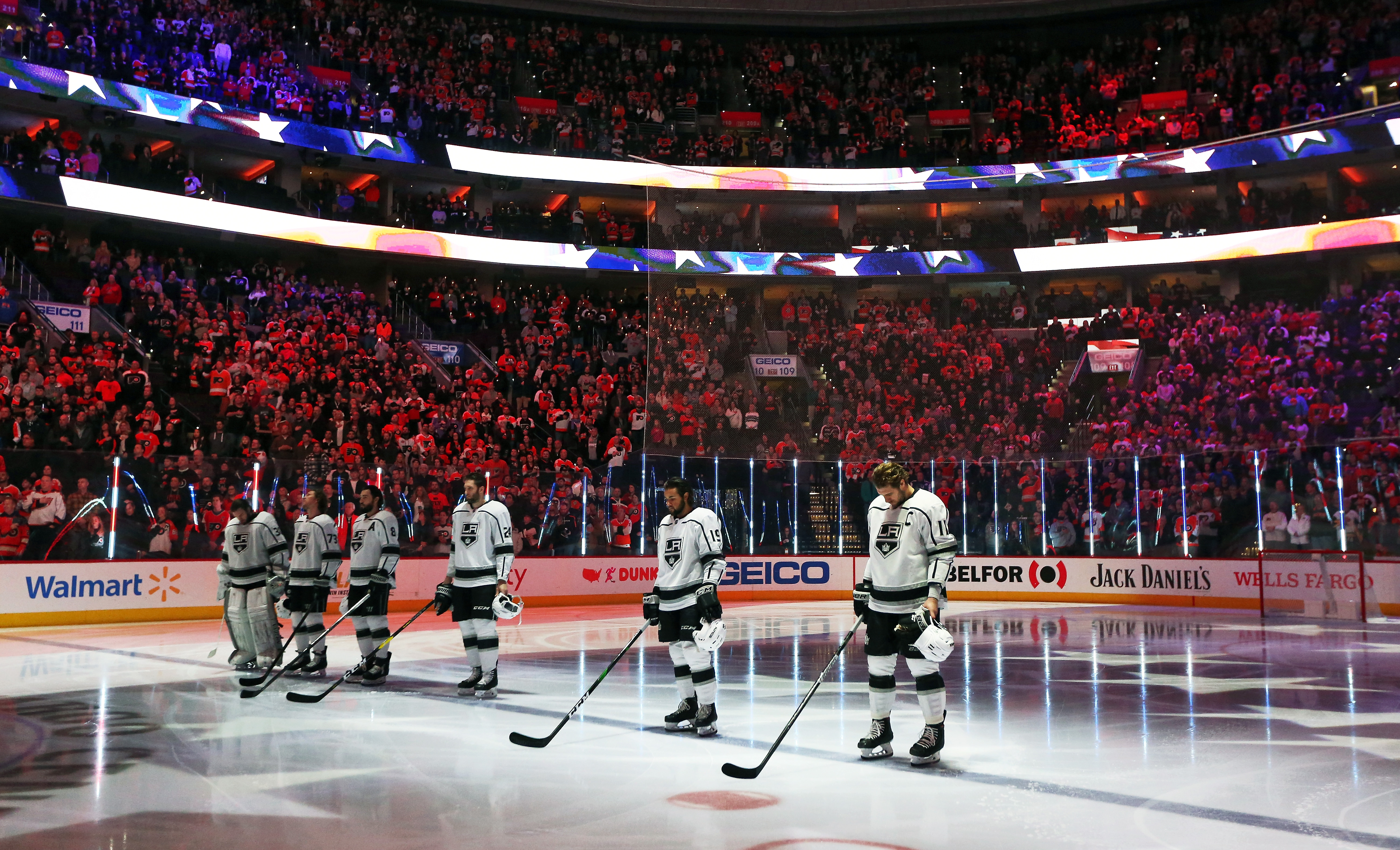 Jack Campbell #36, Tyler Toffoli #73, Drew Doughty #8, Derek Forbort #24, Alex Iafallo #19 and Anze Kopitar #11 of the Los Angeles Kings stand on the blue line during the National Anthem prior to playing the Philadelphia Flyers on January 18, 2020 at the Wells Fargo Center in Philadelphia, Pennsylvania.  