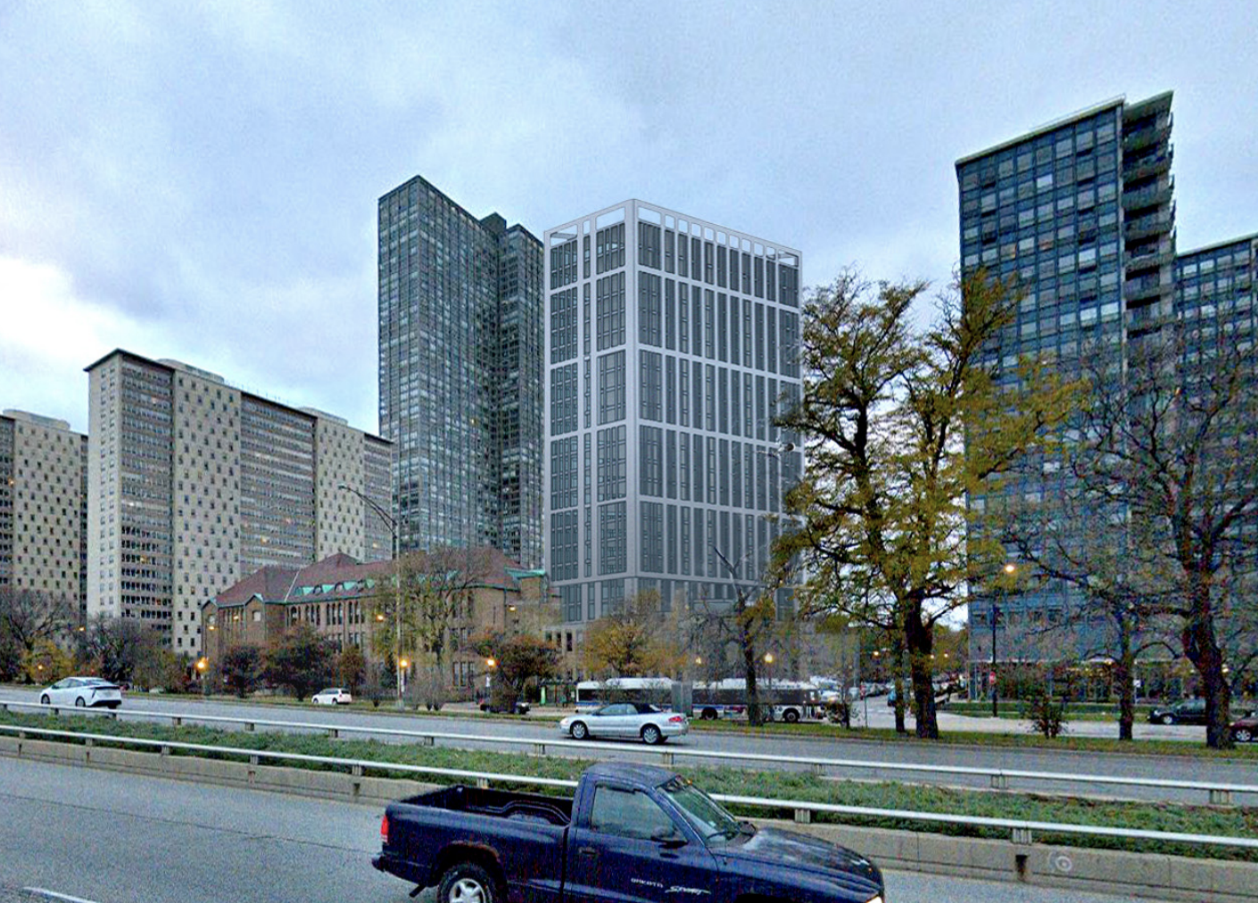 A tall building stands in line with other taller buildings next to low-rise school buildings along Lake Shore Drive.