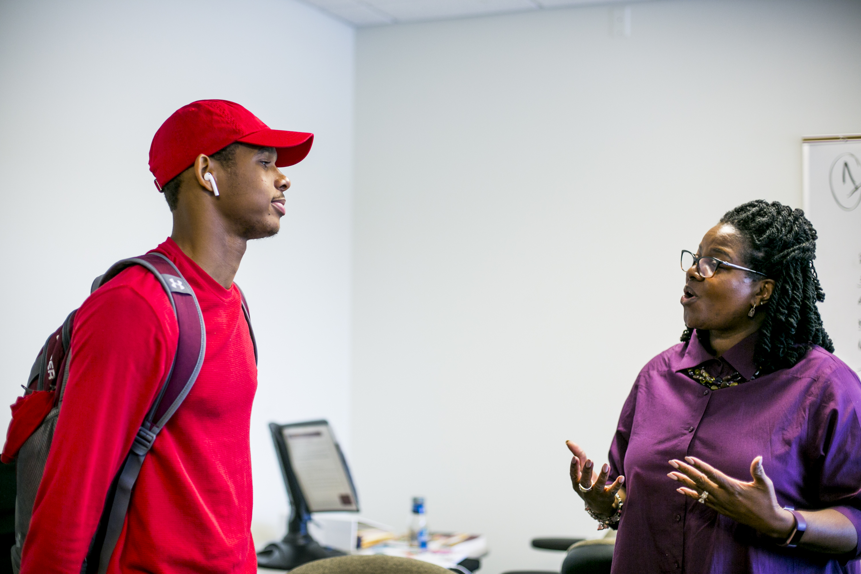 Demetrius Robinson, a freshman at Central Michigan University from Detroit, chats with Mary Henley, who heads a program that helps first generation and low income students succeed on campus.