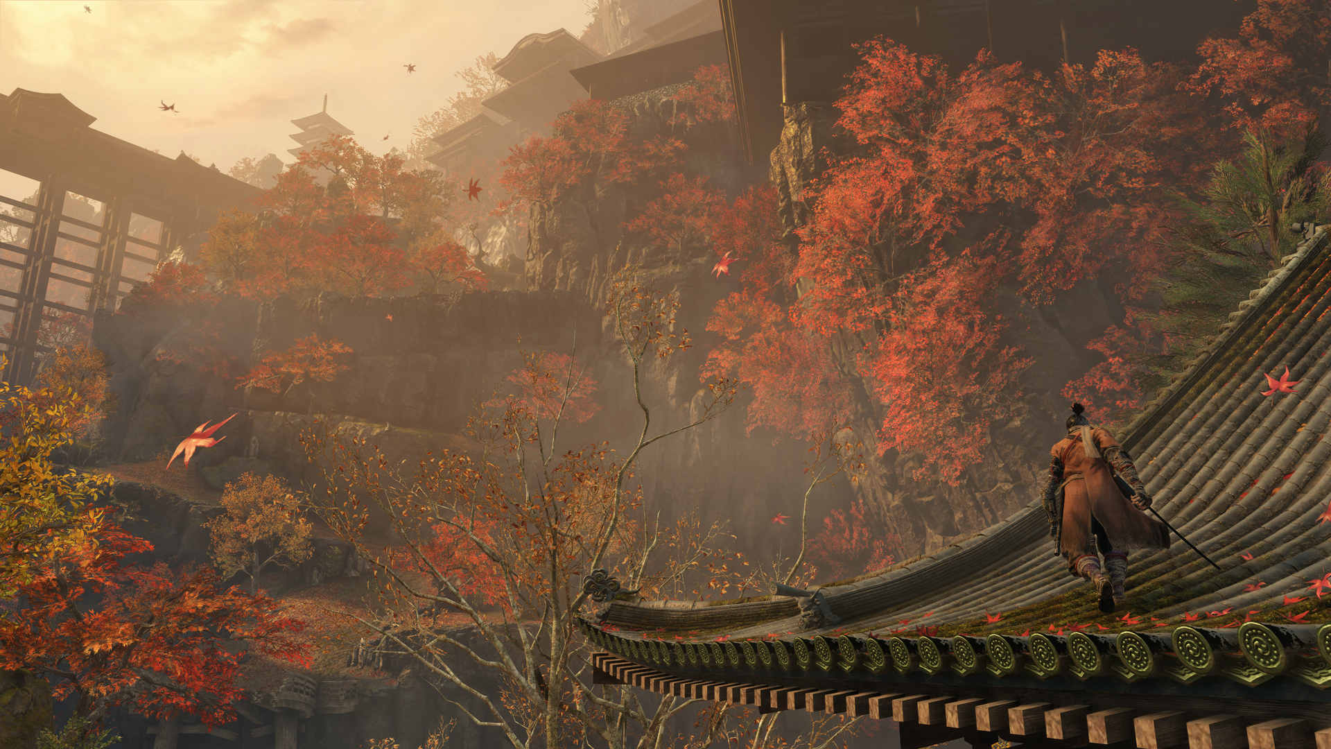 a ninja walks along a rooftop in a lush autumn landscape in Sekiro: Shadows Die Twice