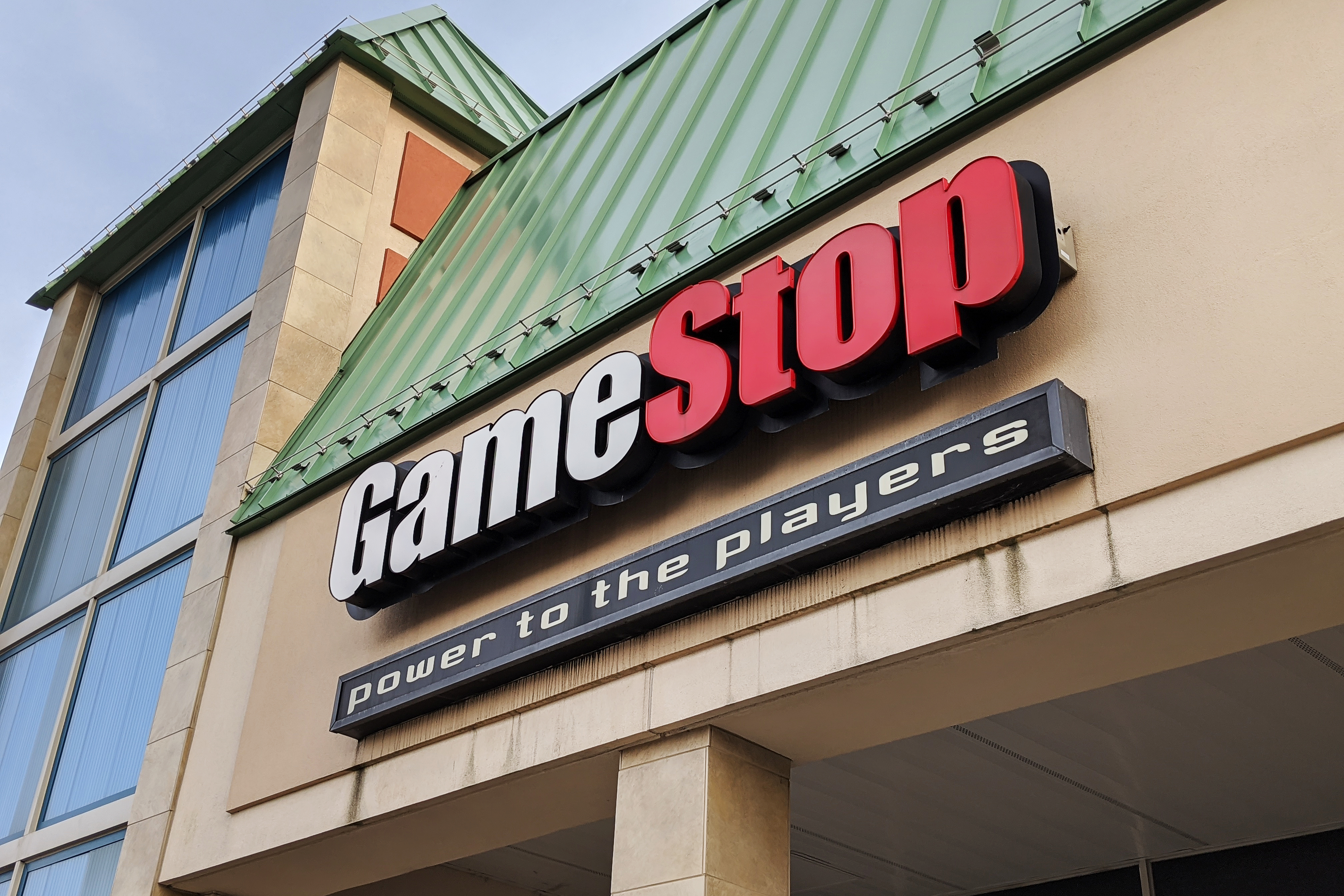 GameStop sign on the front of a strip mall building