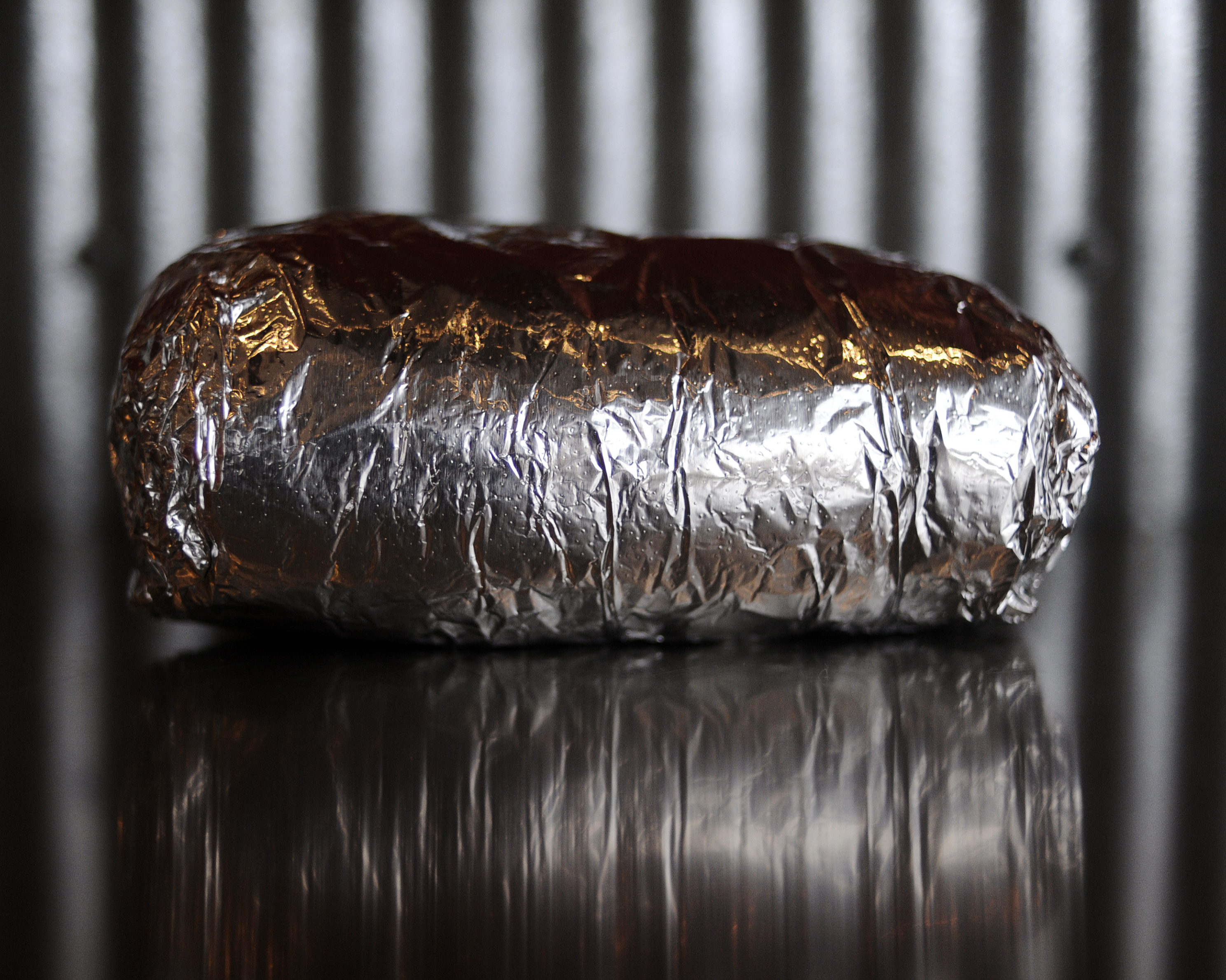 A Chipotle burrito in it’s signature aluminum wrap on Friday, February 12, 2010. Burrito was that the original location on E. Evans Ave. Cyrus McCrimmon, The Denver Post