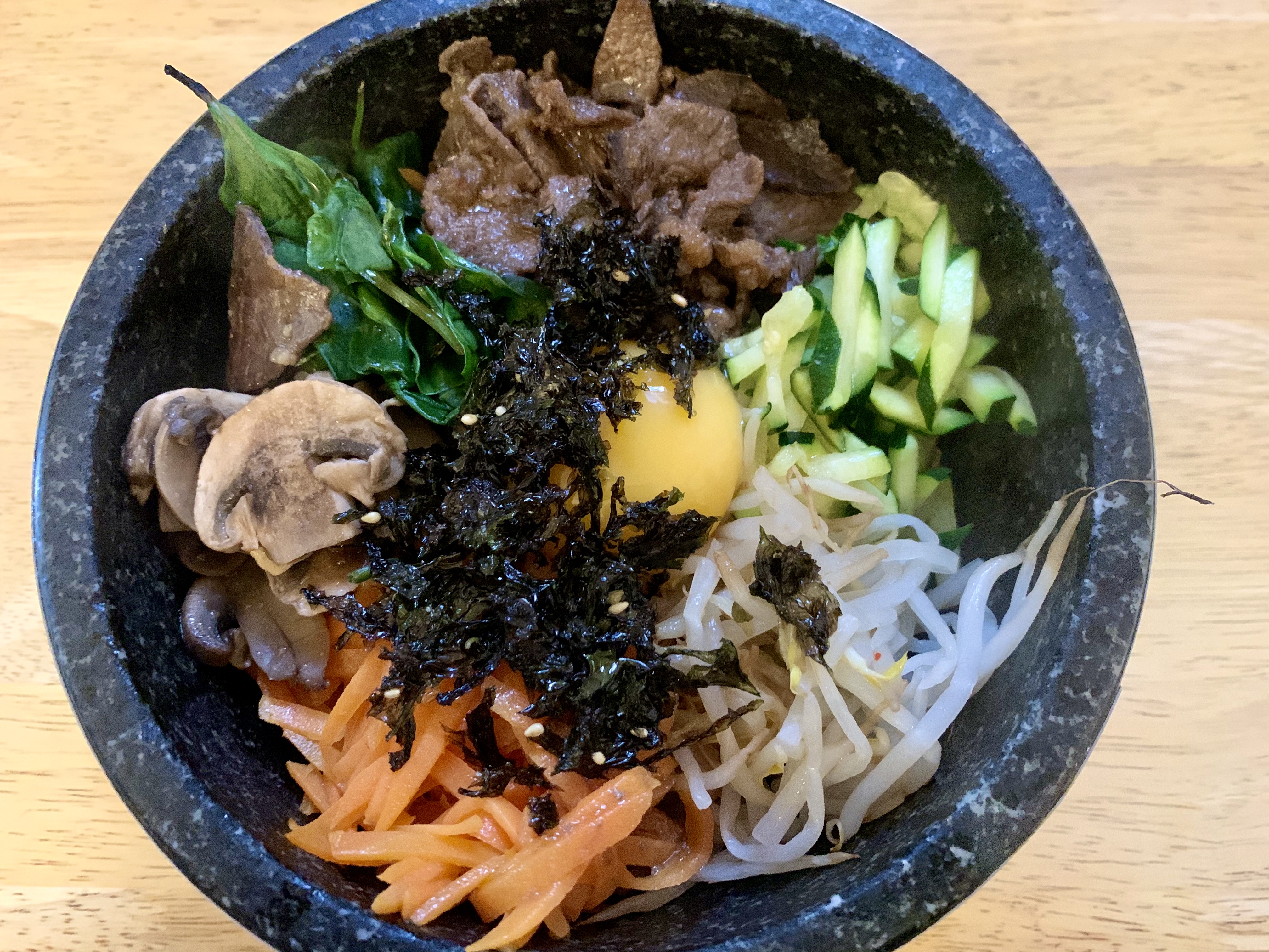 Bibimbap with carrot, pickles, and egg yolk