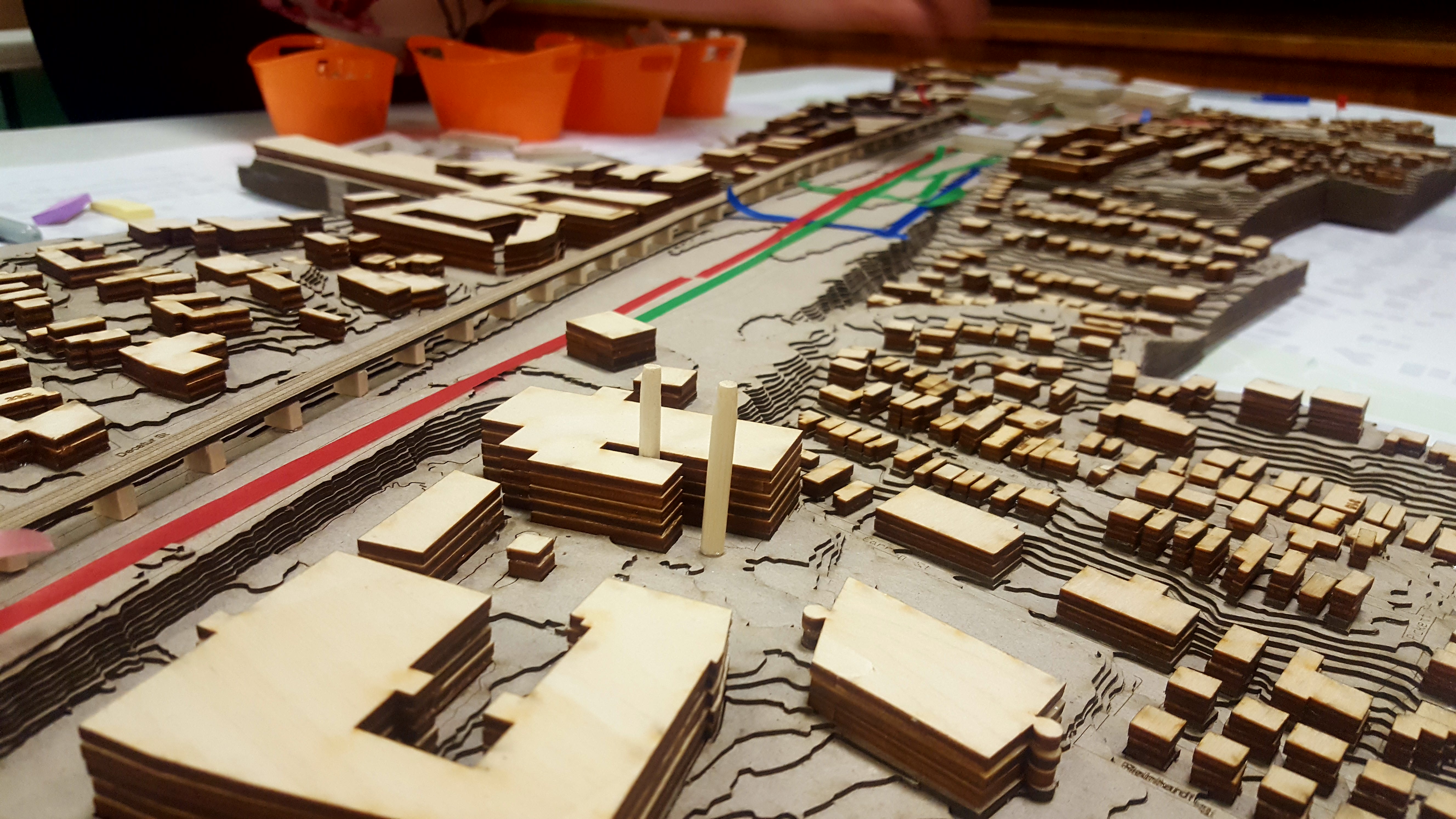 a picture of a wooden model of the yard and its surroundings