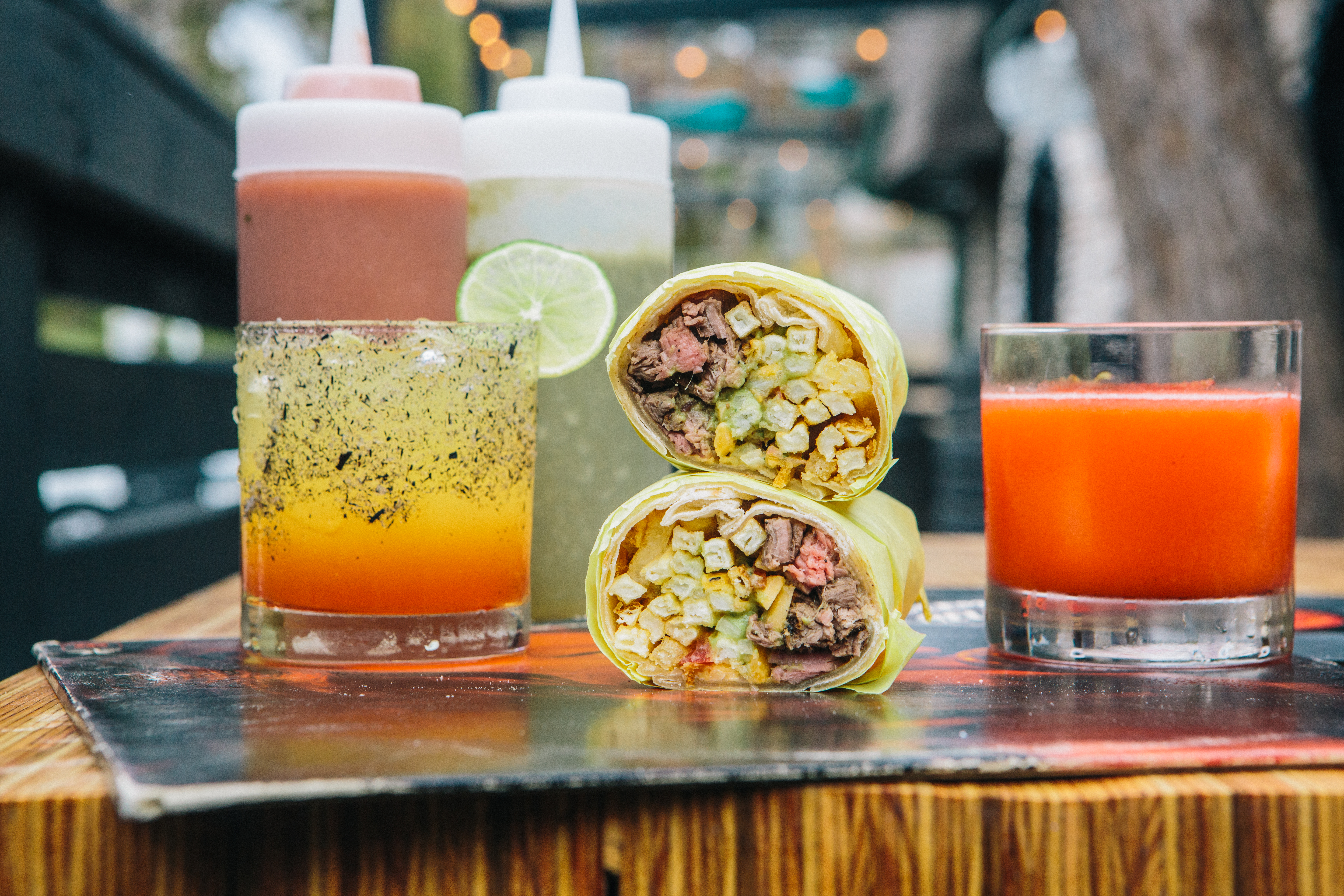 The San Diego burrito at Troublemaker, along with some cocktails